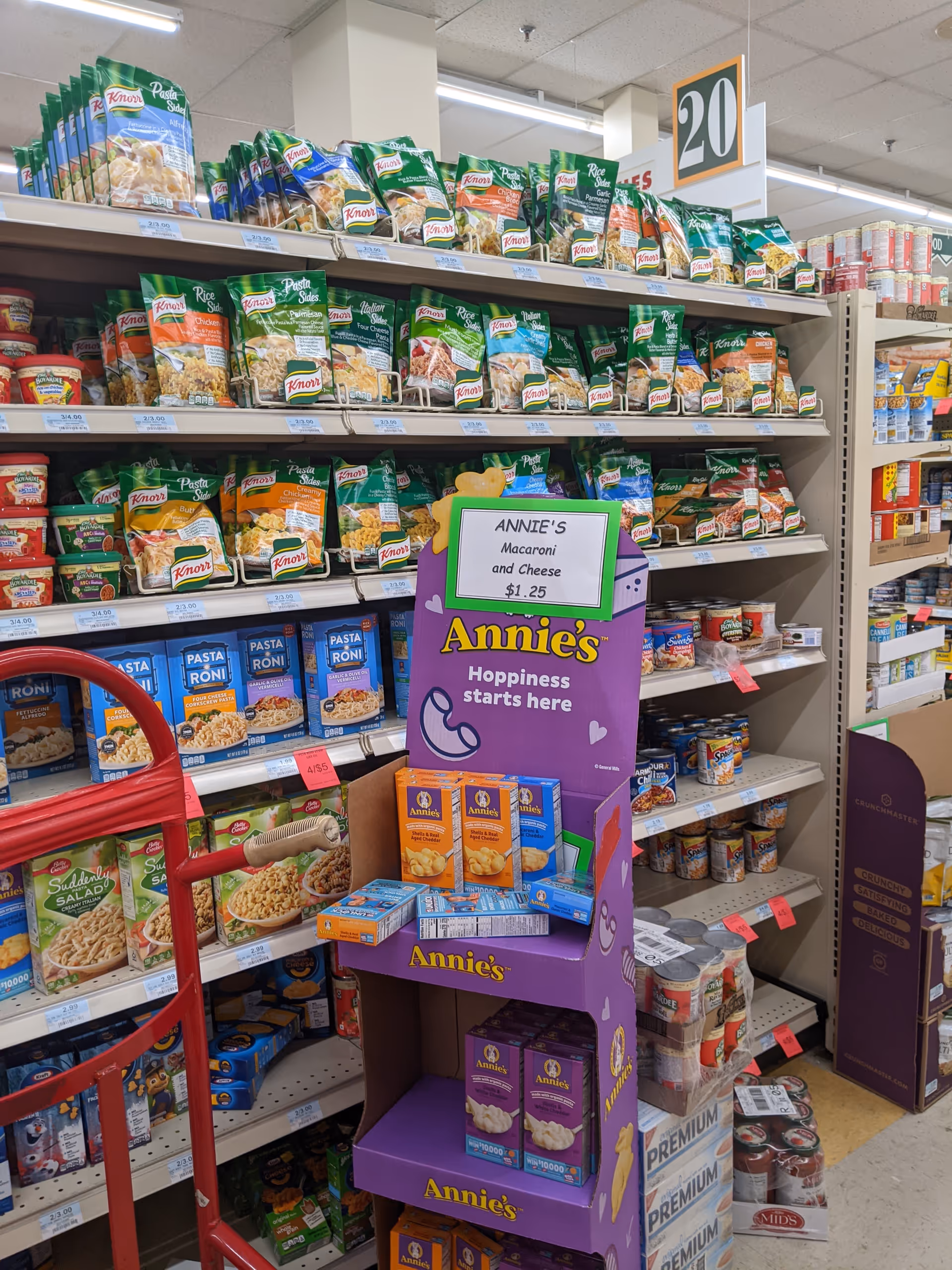 Aisle in Discount Drug Mart stocked with Knorr pasta sides and an Annie's display.