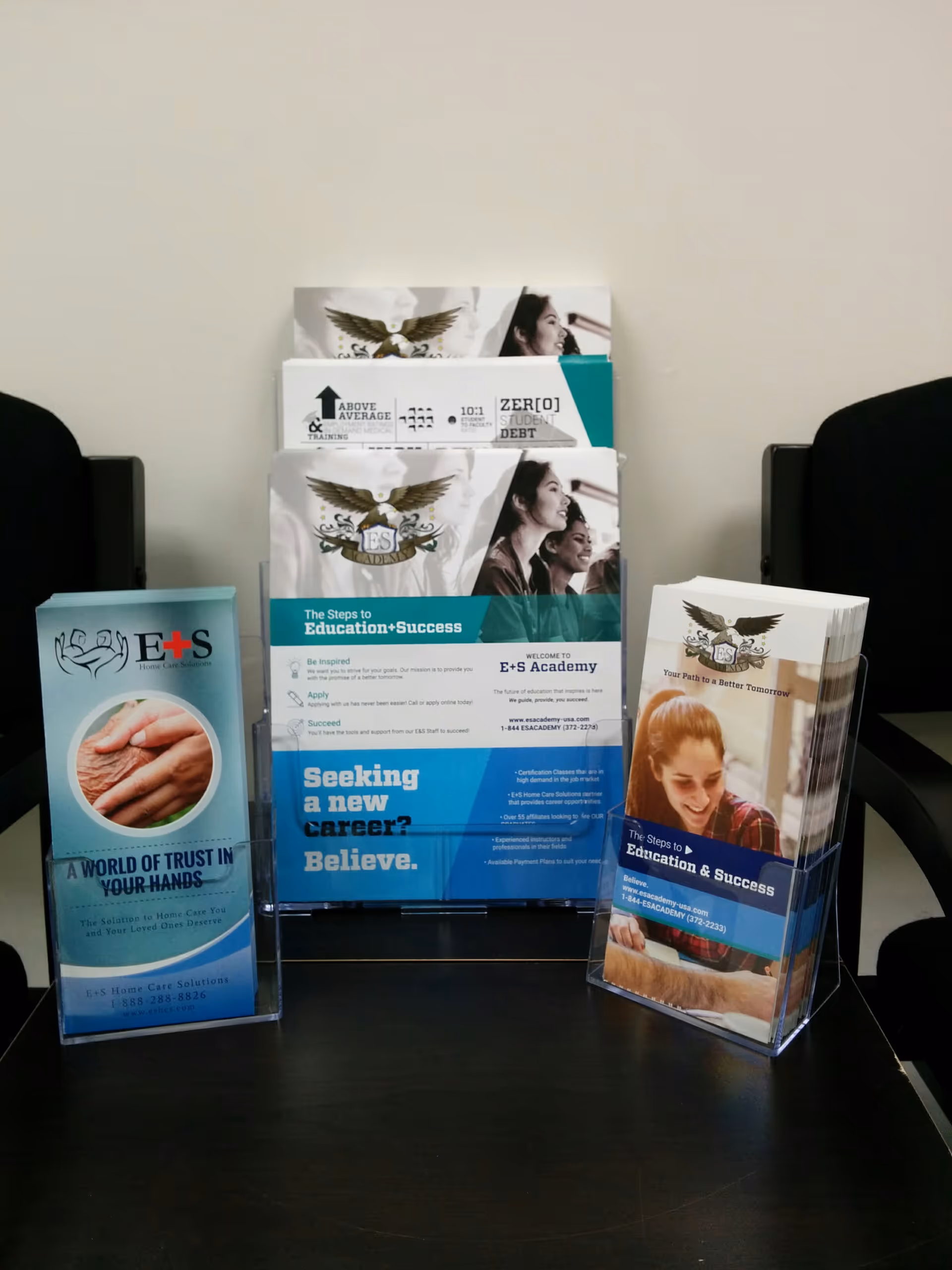 Informational brochures for E & S Home Care Solutions on a lobby table.