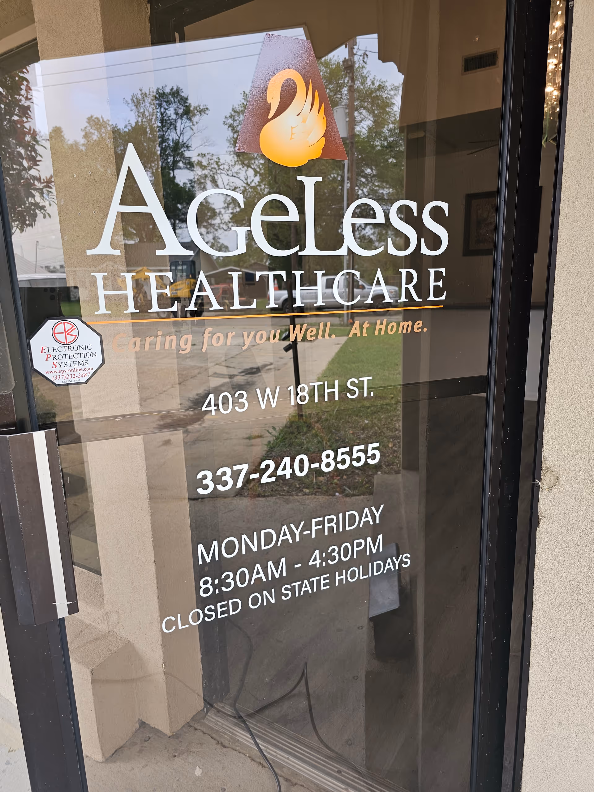 Glass door storefront showing Ageless Healthcare sign, address, phone number, and hours.