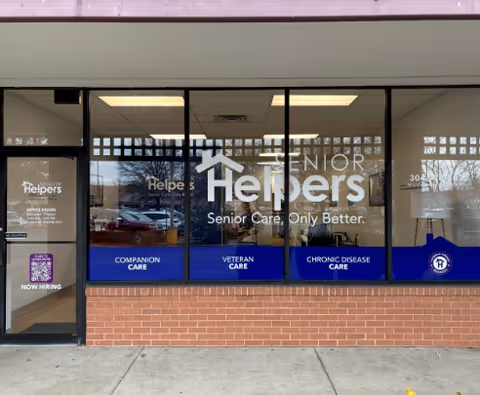 Front view of Senior Helpers storefront with large windows and signage.
