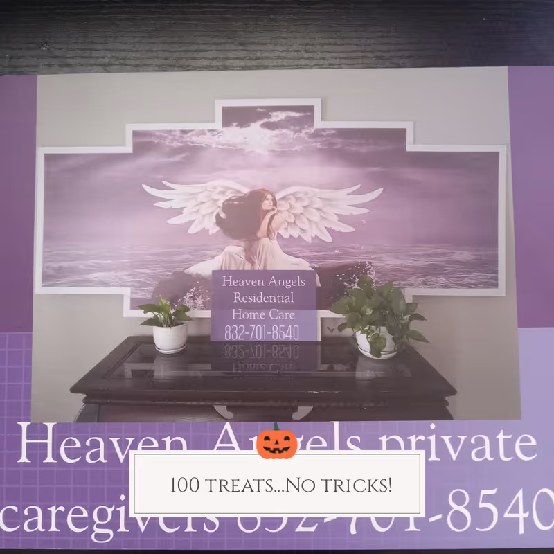 Purple interior wall with Heaven Angels sign, angel artwork, and a table with plants.