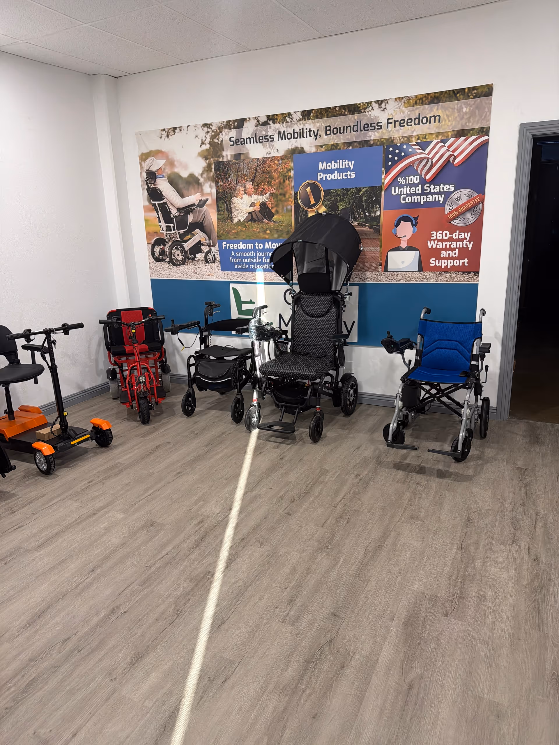 Interior room with mobility devices like wheelchairs and walkers against a wall.