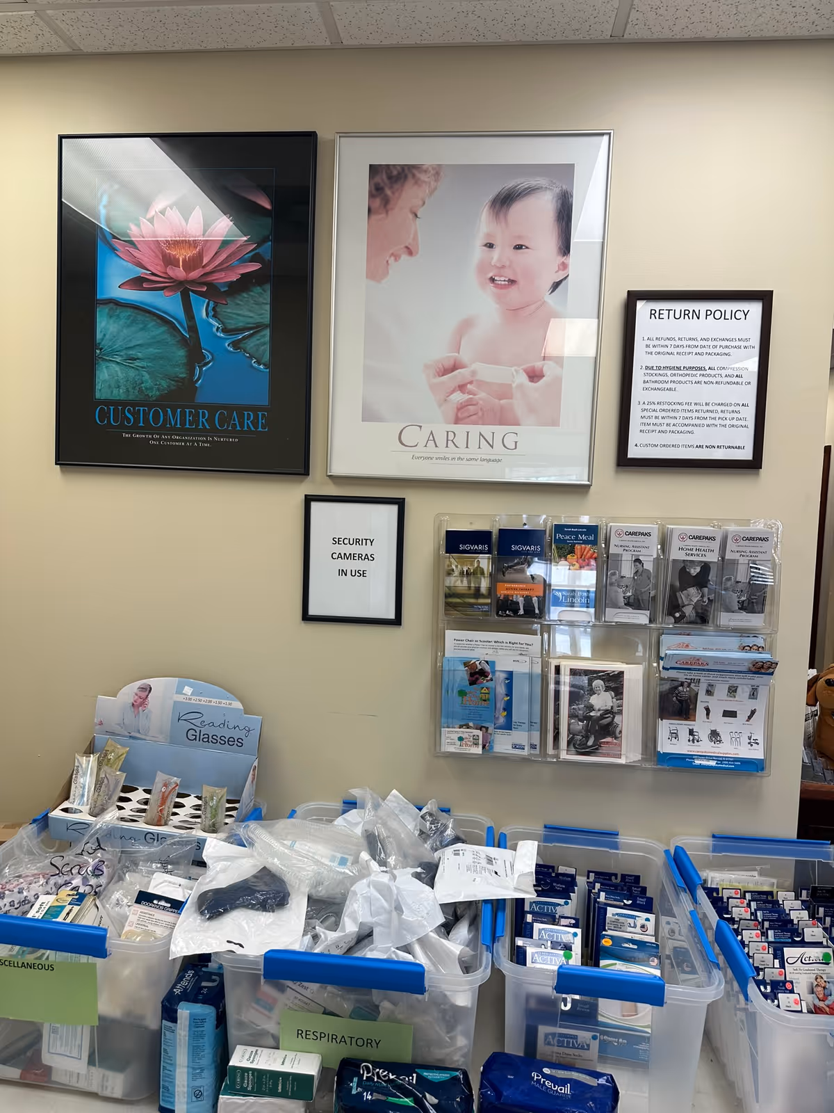 Carepaks Health Services interior with posters, brochures, and medical supply bins.