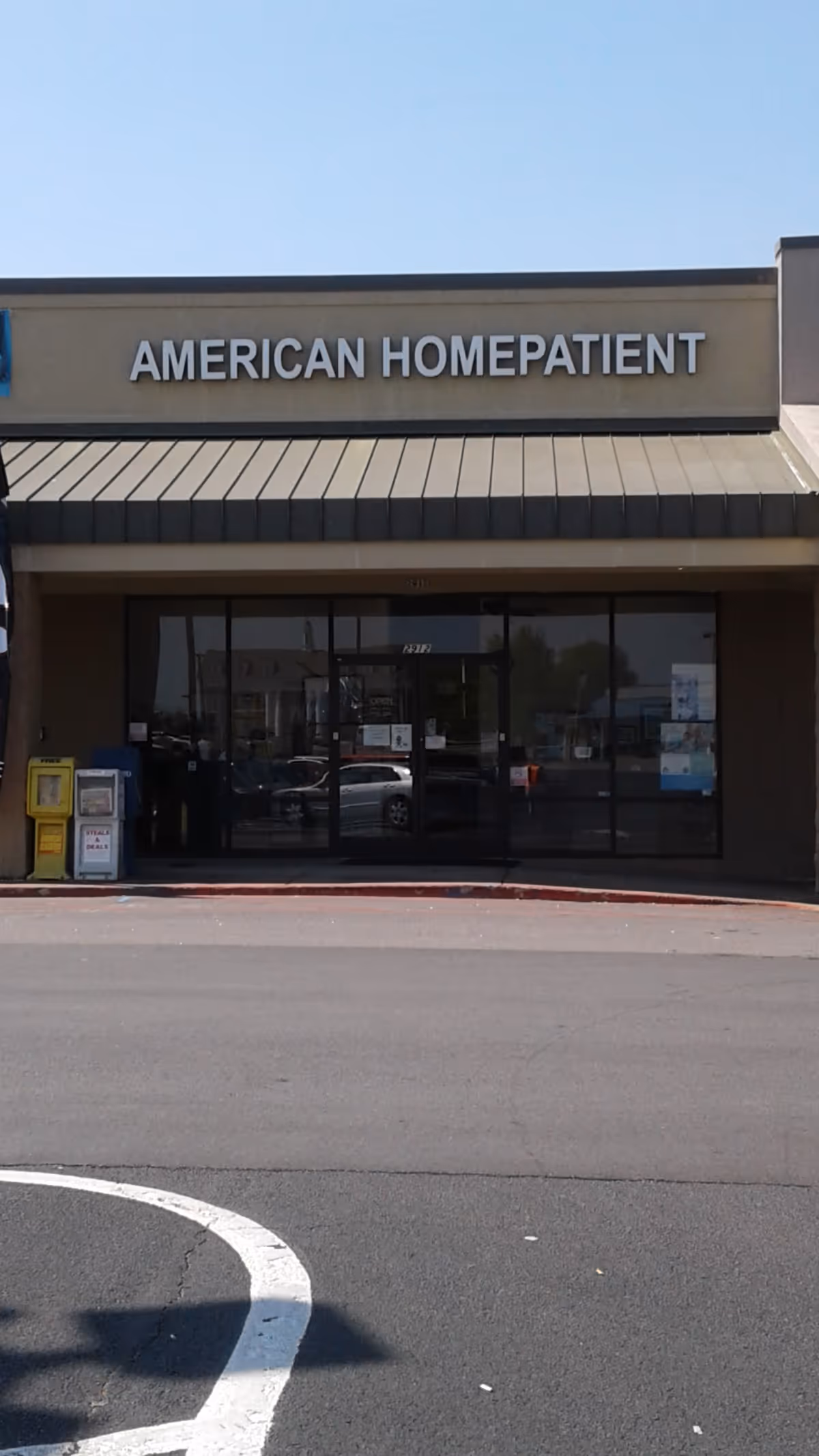 Front facade of a storefront with American HomePatient signage.