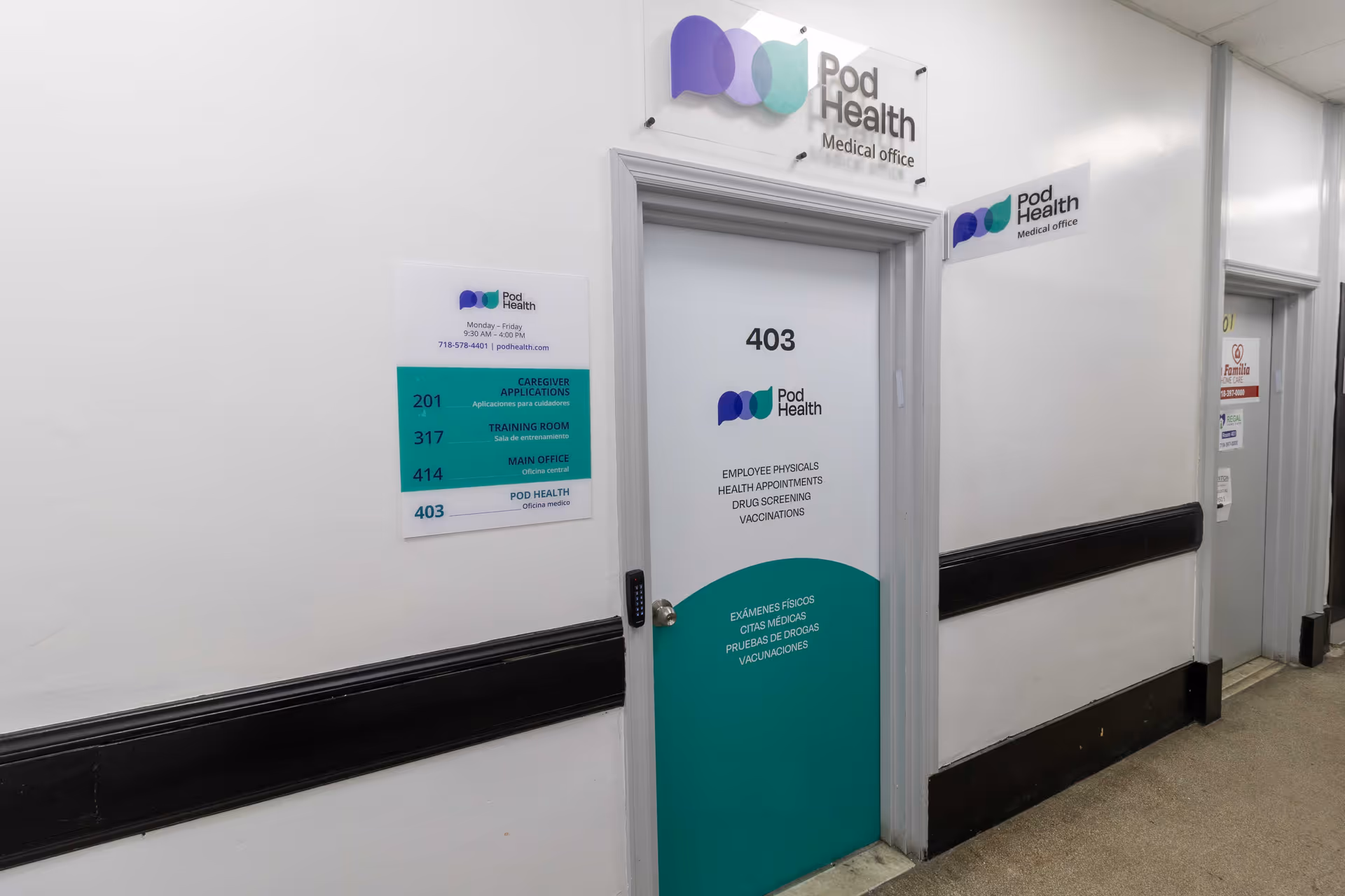 Clinic-like hallway with Pod Health door and wall signage.