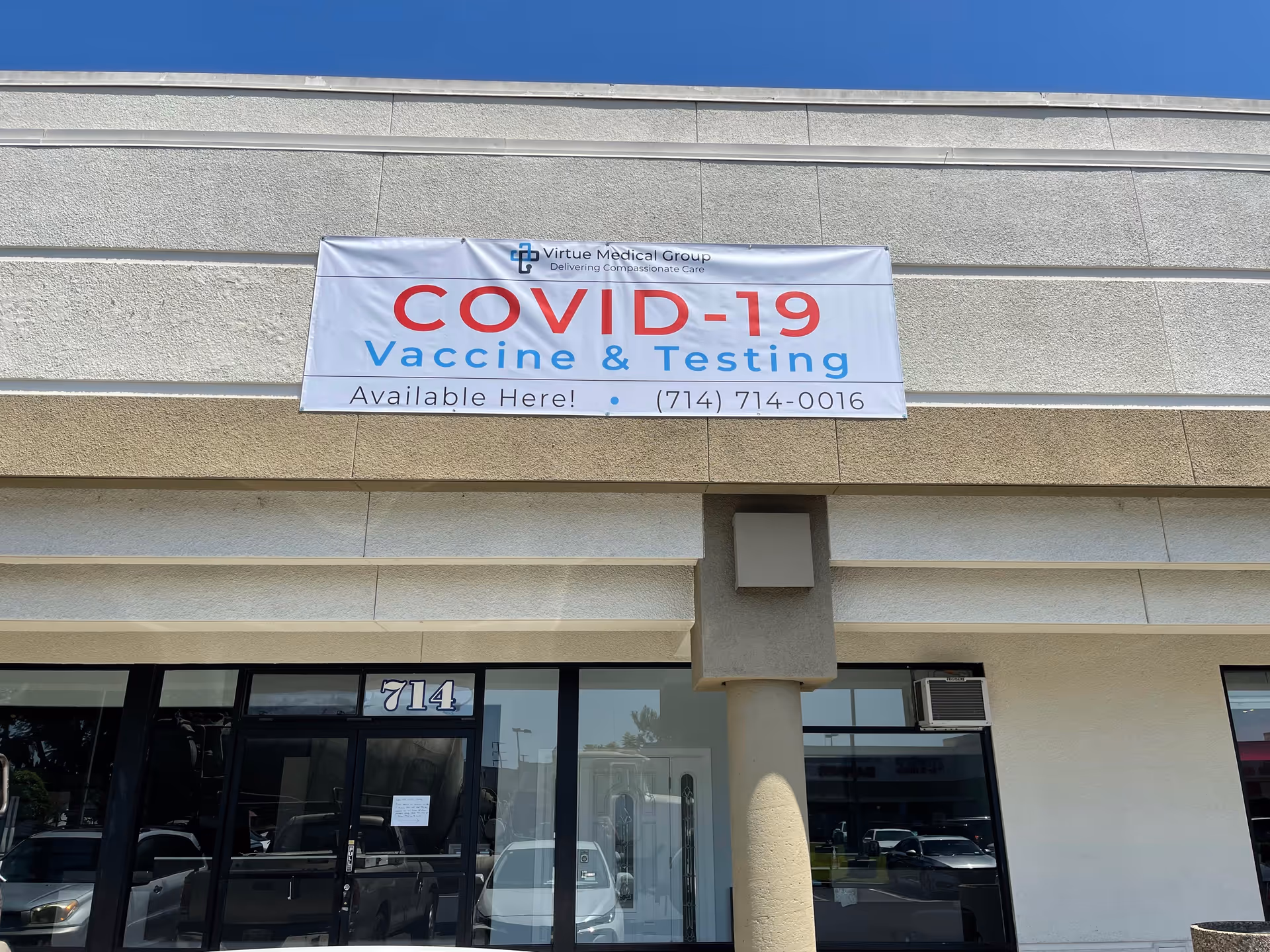 Front view of Virtue Medical Group building with a COVID-19 vaccine banner.