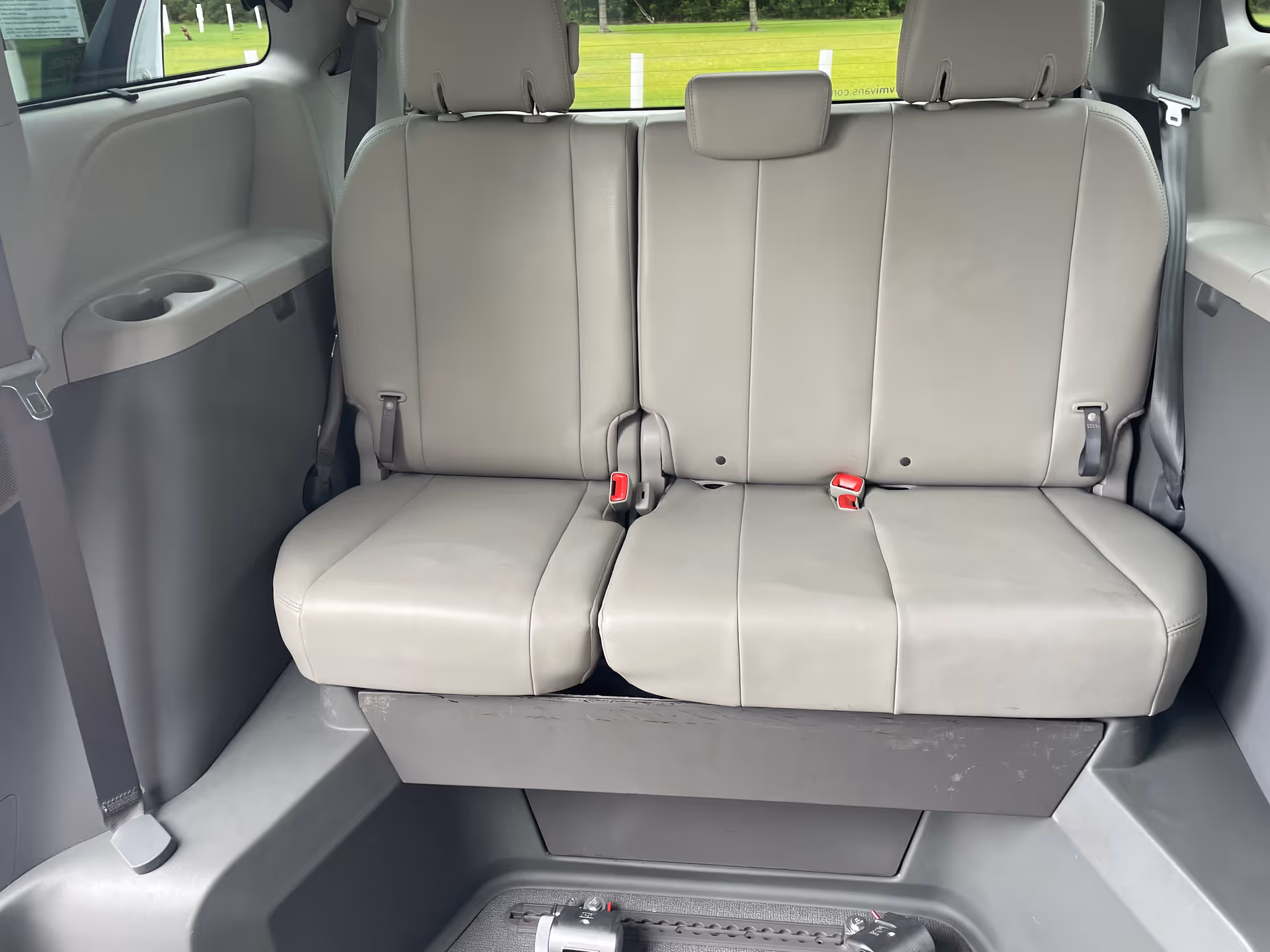 Gray leather seats in the rear interior of a MobilityWorks van