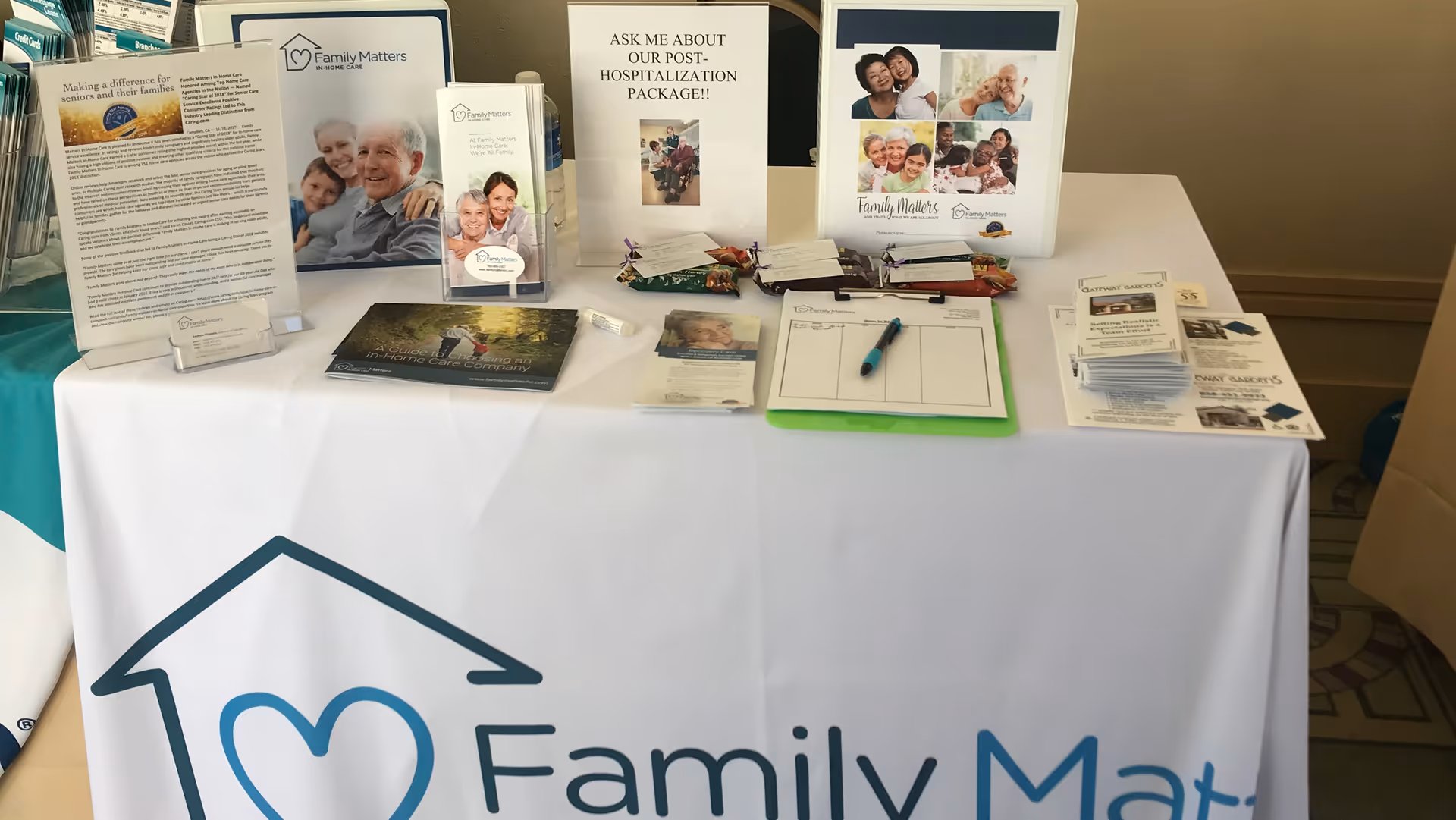 Indoor display table with Family Matters In-Home Care marketing materials.