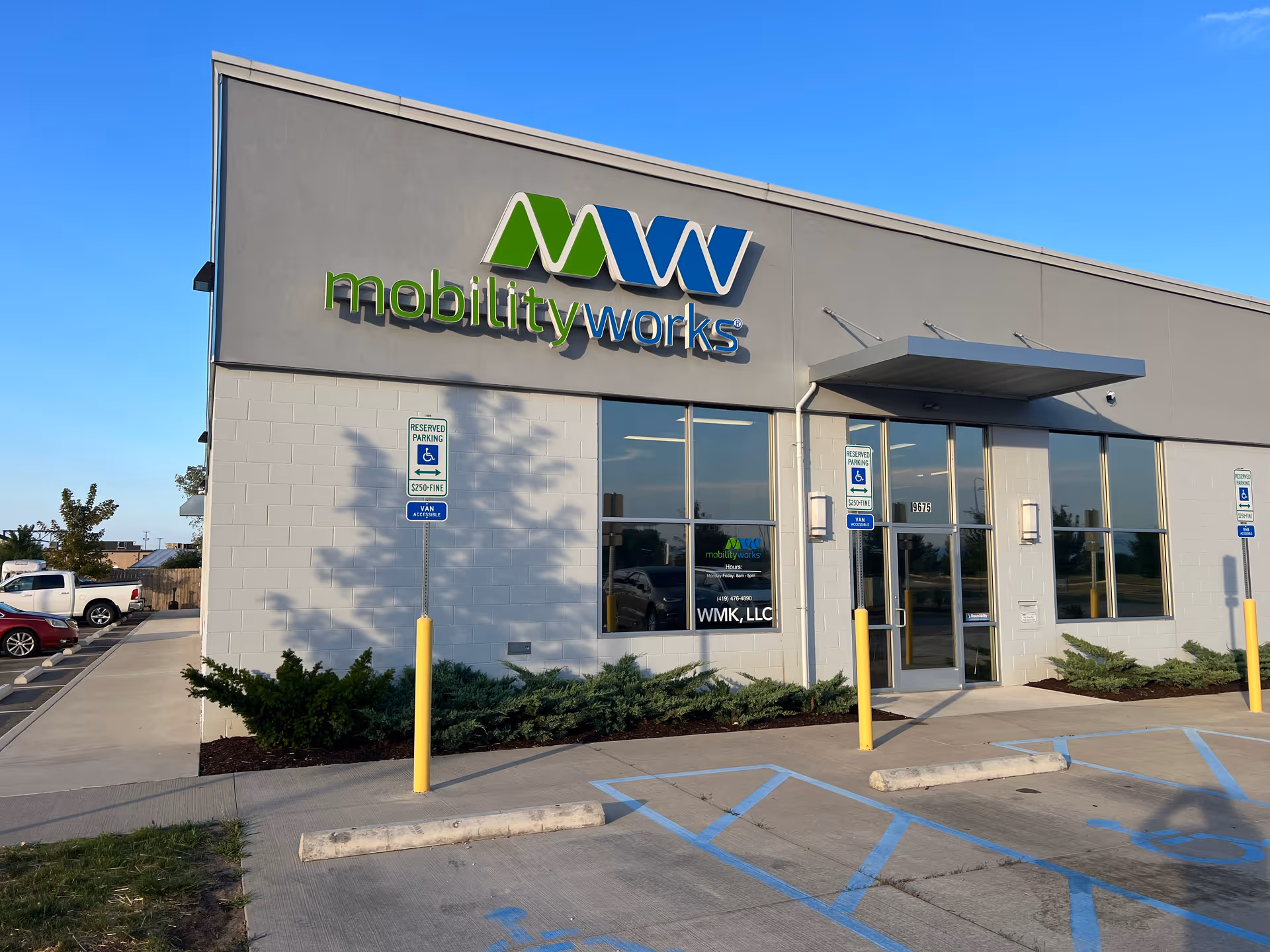 Exterior view of MobilityWorks building with large logo and glass entrance.