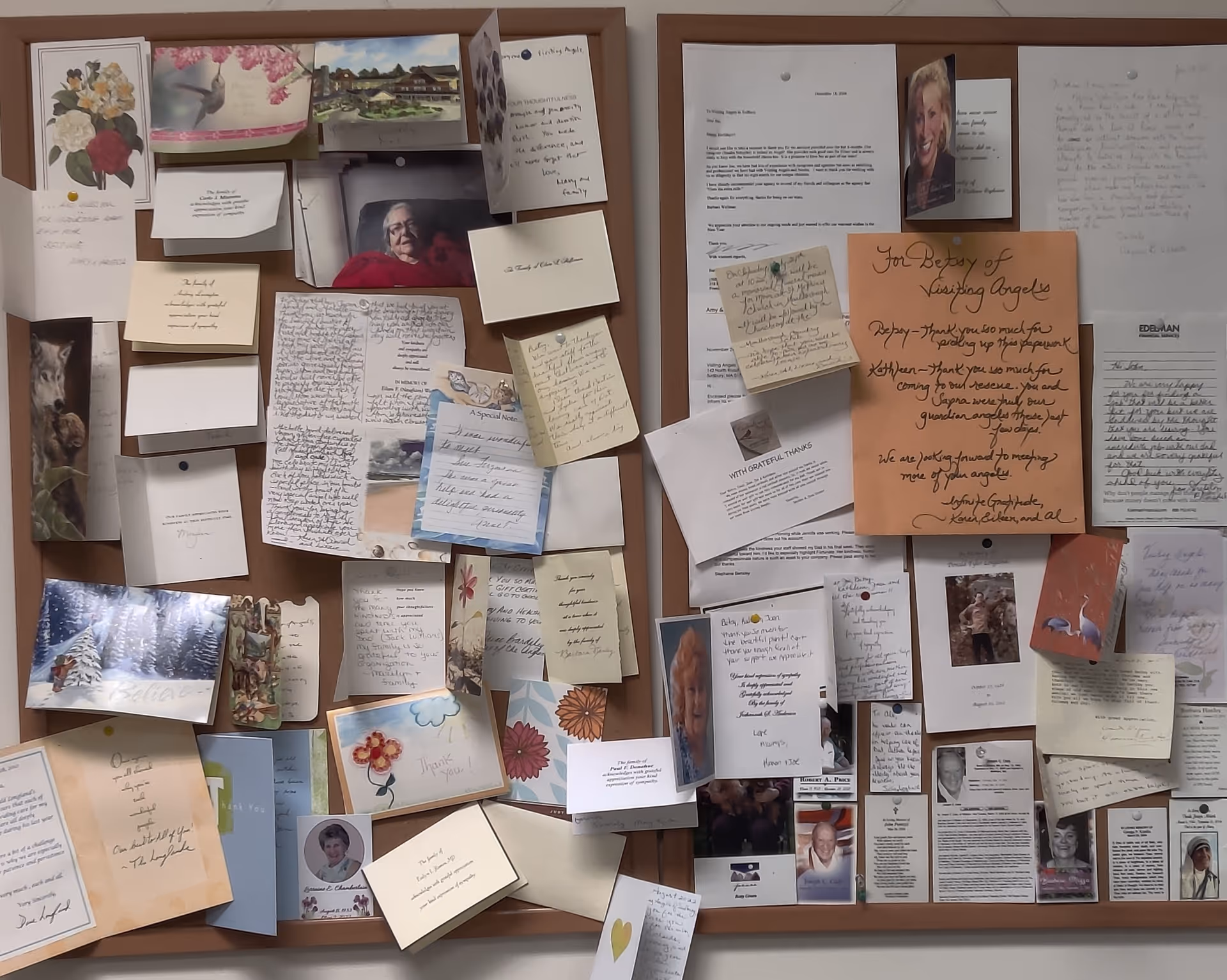 Cork bulletin board covered with notes, photos, and greeting cards.
