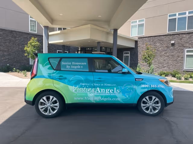 Colorful Visiting Angels van parked at the front entrance of the Wayzata facility.