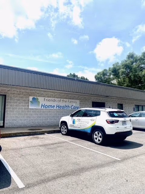 Front exterior of Friends of the Family Home Health Care building with a parked SUV