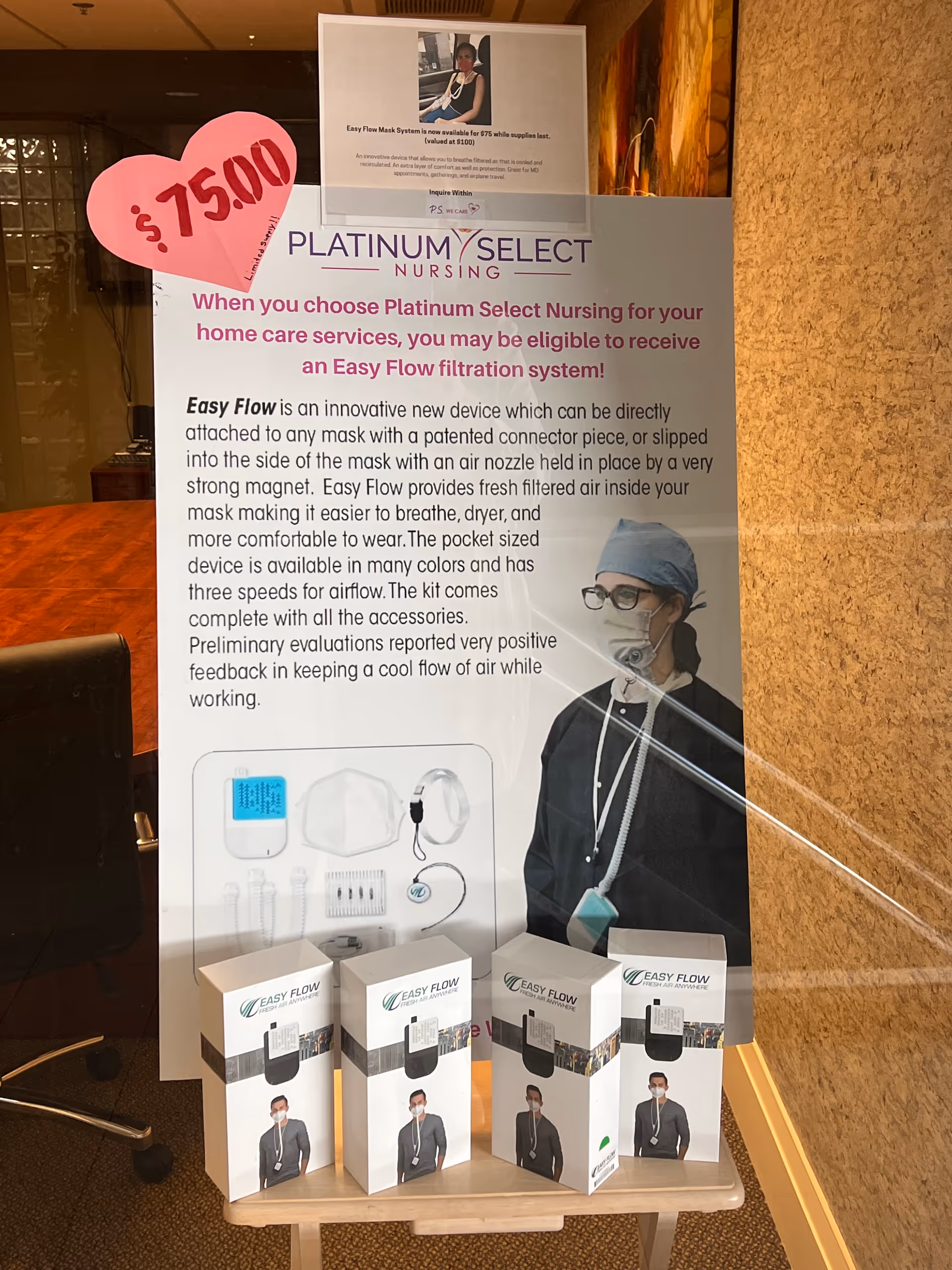 Indoor lobby display with a large nursing poster and Easy Flow product boxes on a table.