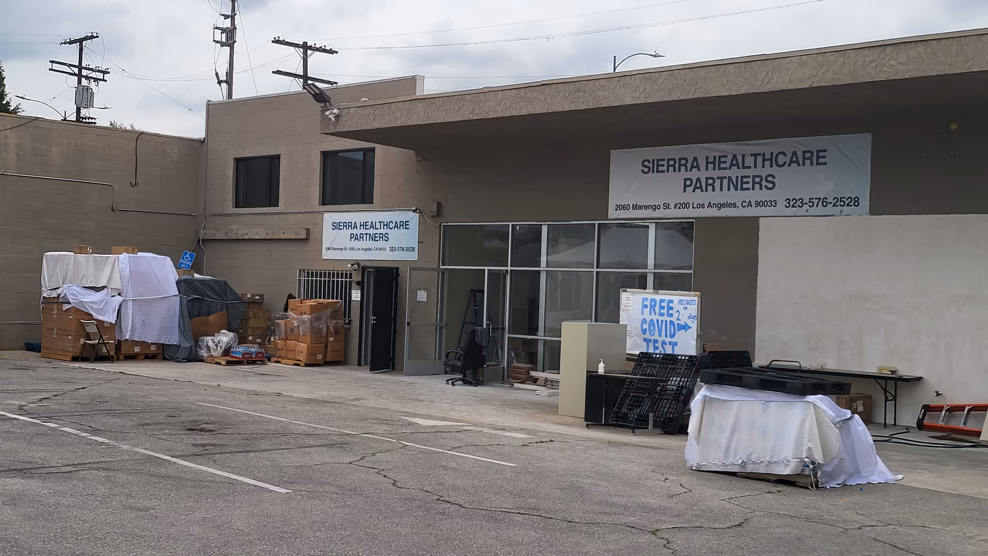 Exterior view of Sierra Healthcare Partners building with signs and outdoor items.
