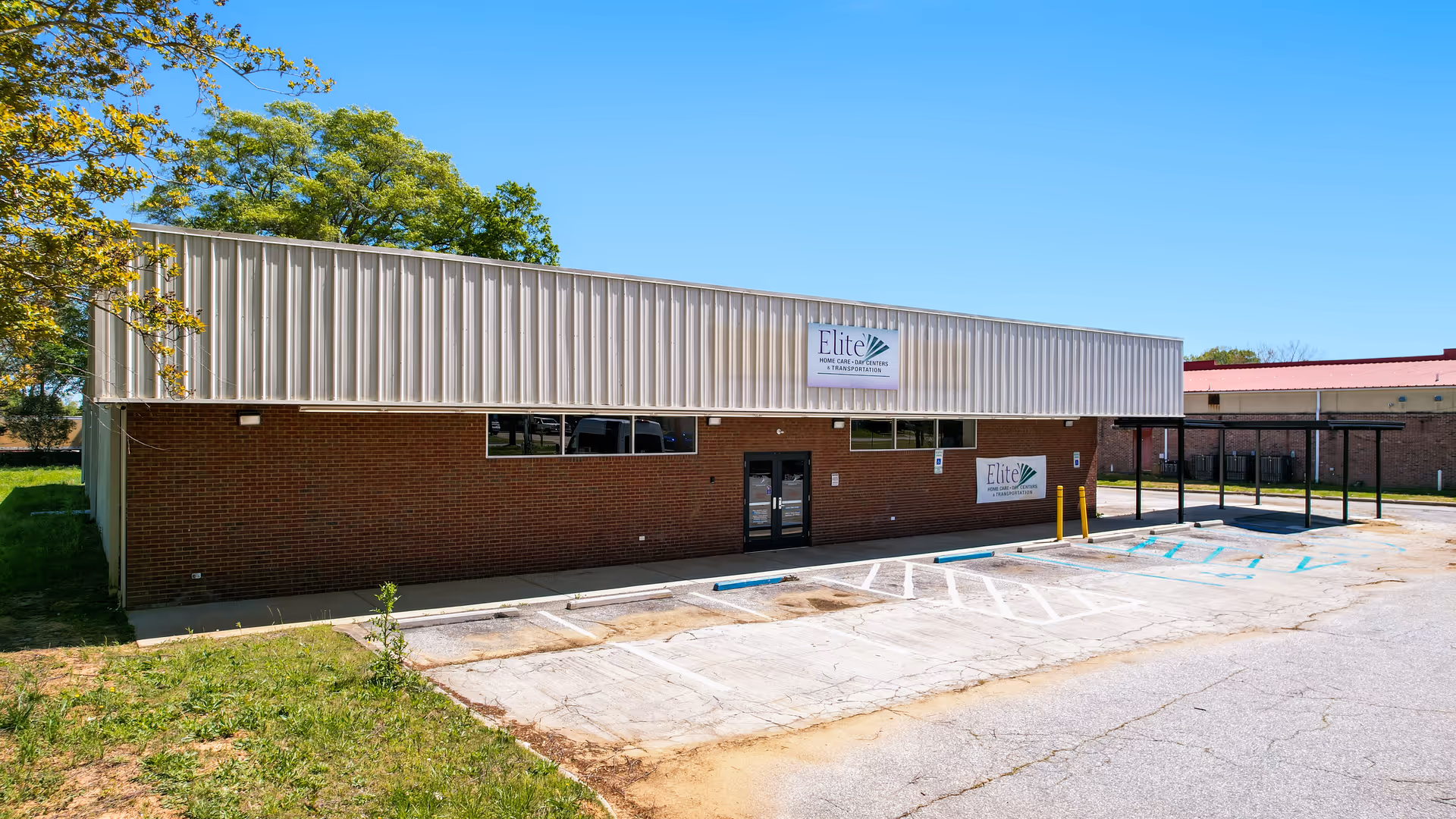 Exterior view of Elite Home Care and Day Centers building with parking lot.