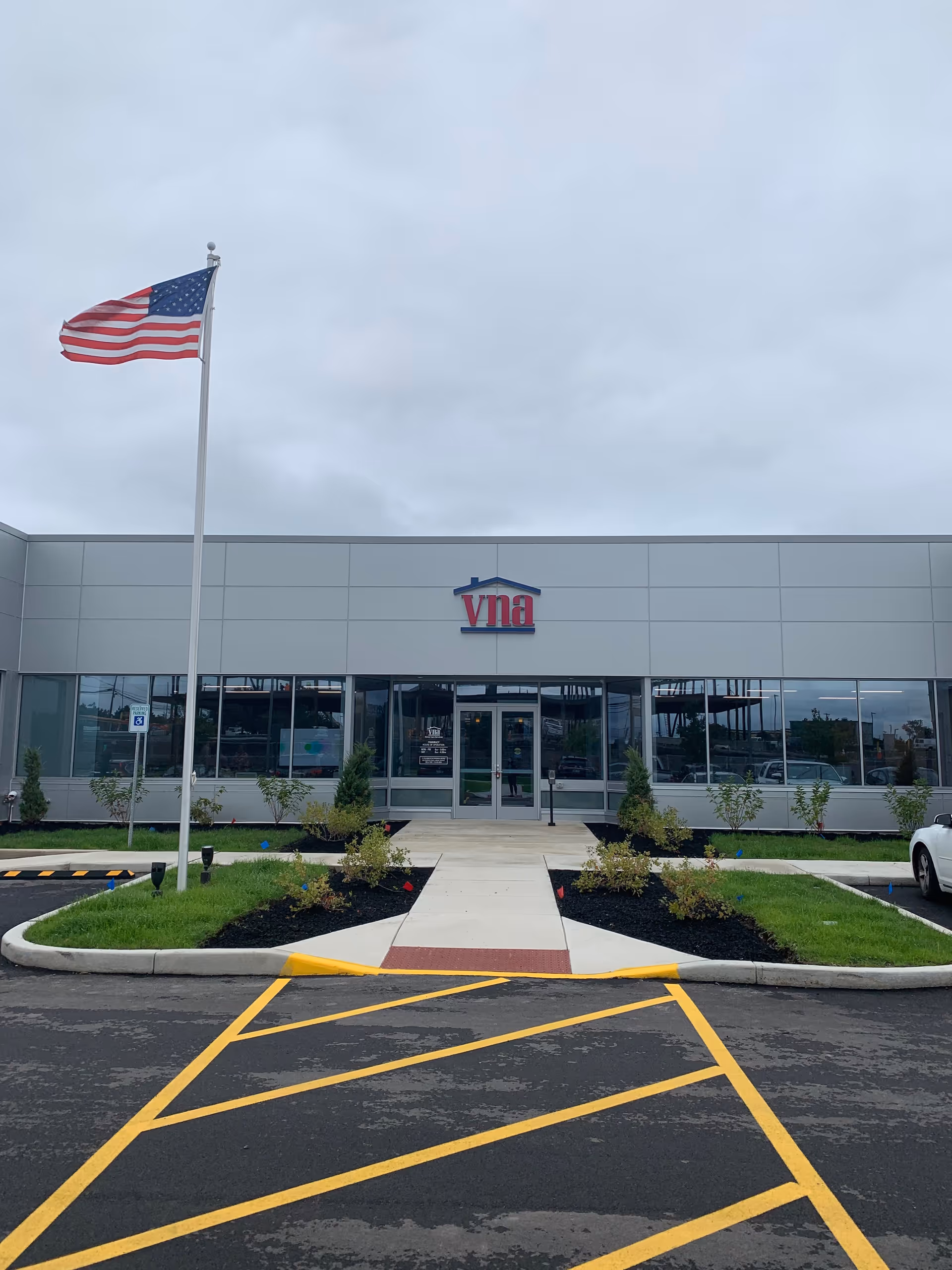 Front view of VNA of WNY facility with flag and entrance