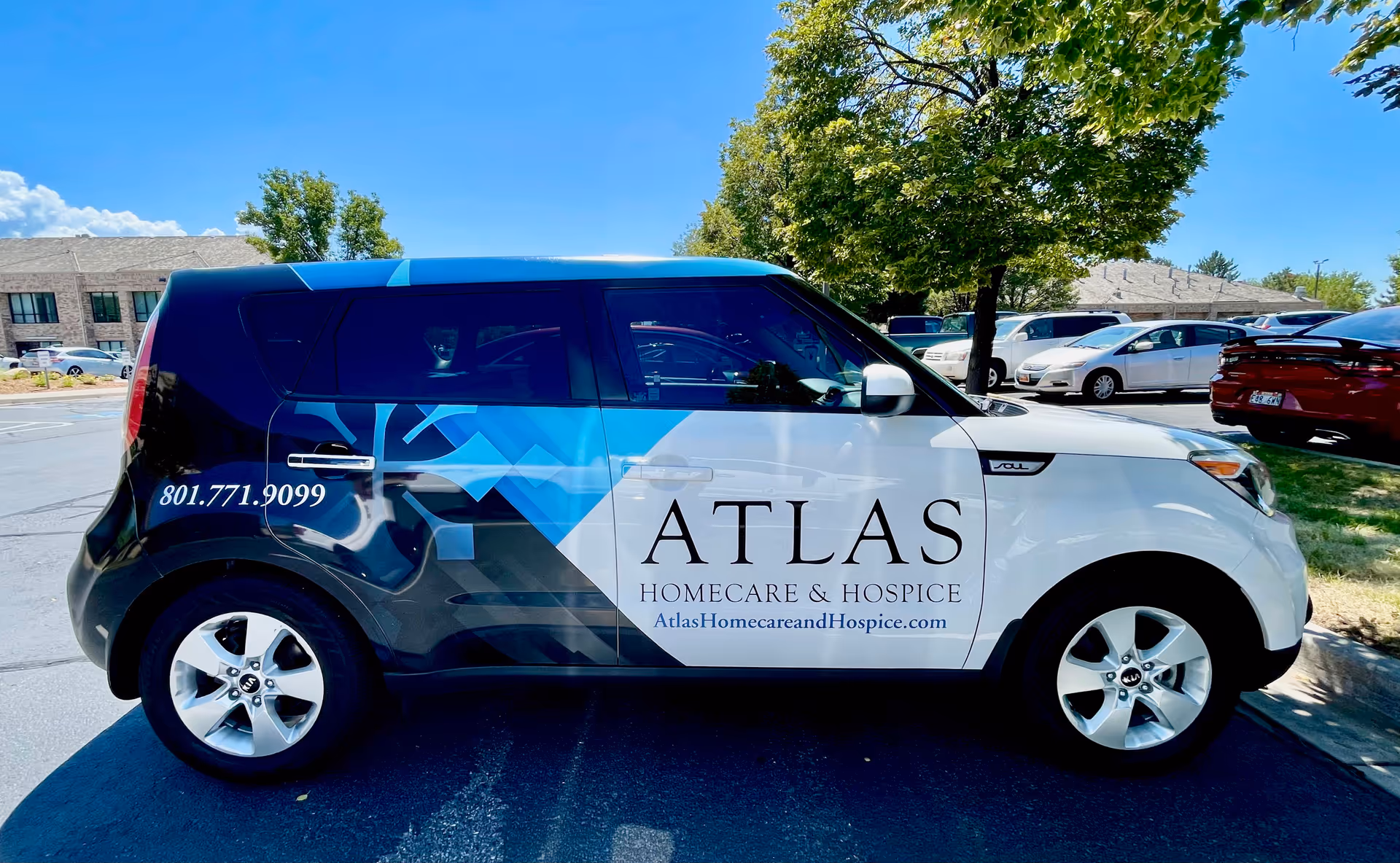 Atlas Homecare and Hospice van parked in a sunny parking lot.