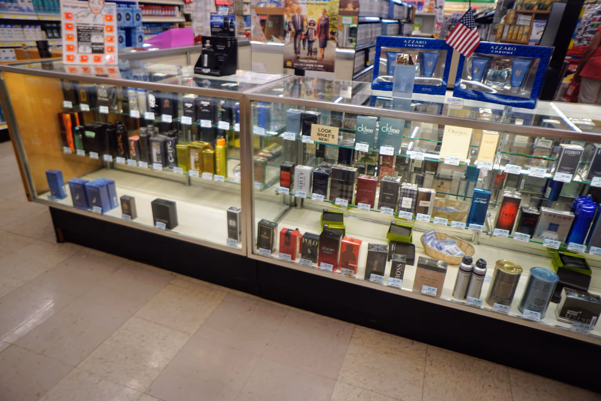 Discount Drug Mart interior featuring glass display cases of perfumes.