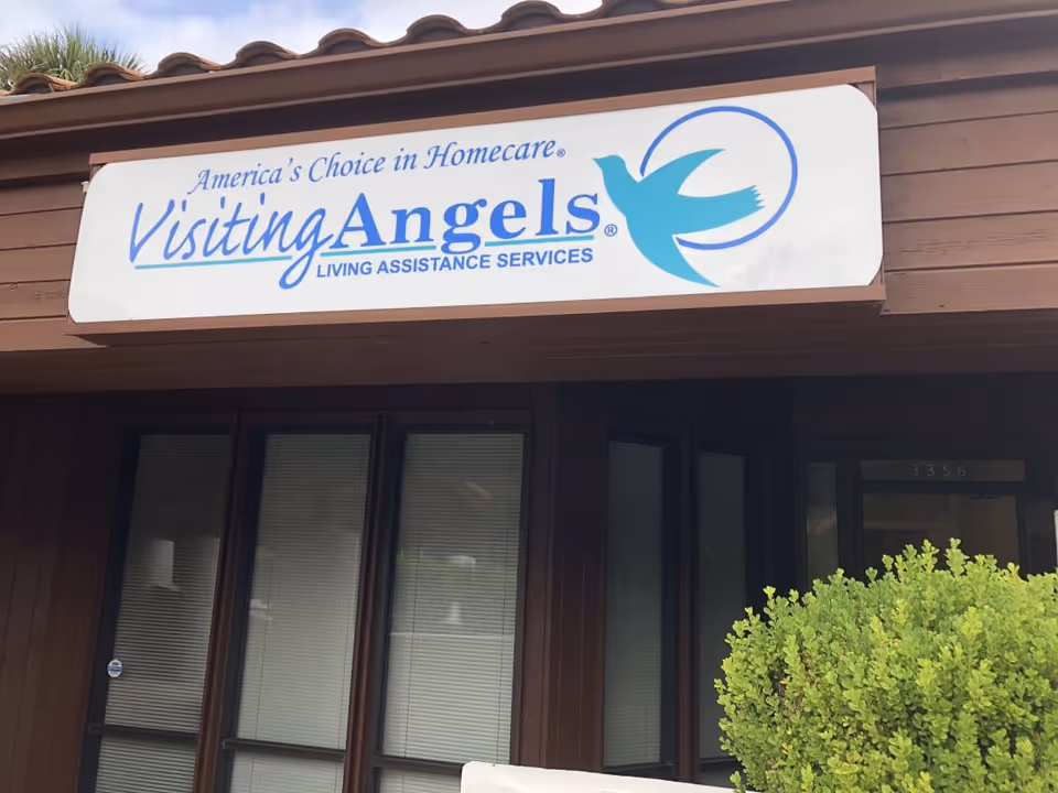 Exterior view of a Visiting Angels facility with a large sign above the entrance.