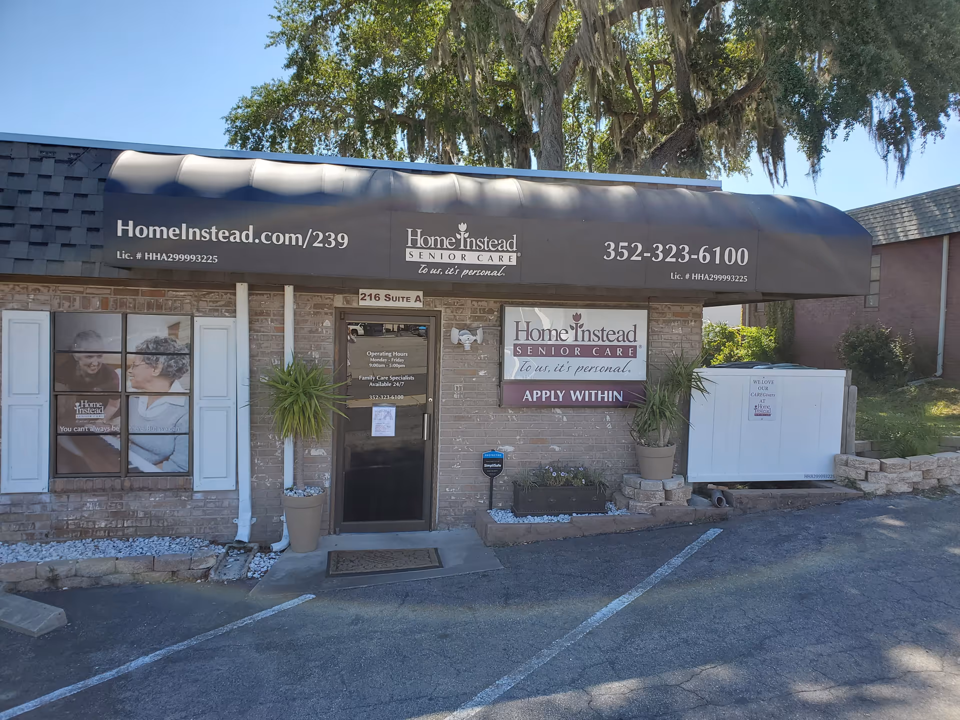 Front exterior of Home Instead Senior Care building with awning and signs.