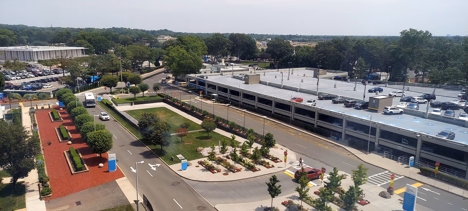 Aerial view of Parker Jewish Institute campus with parking, roads, and landscaped outdoor spaces.