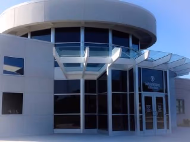 Modern Rankin Rehabilitation facility exterior with curved overhang and glass entrance.