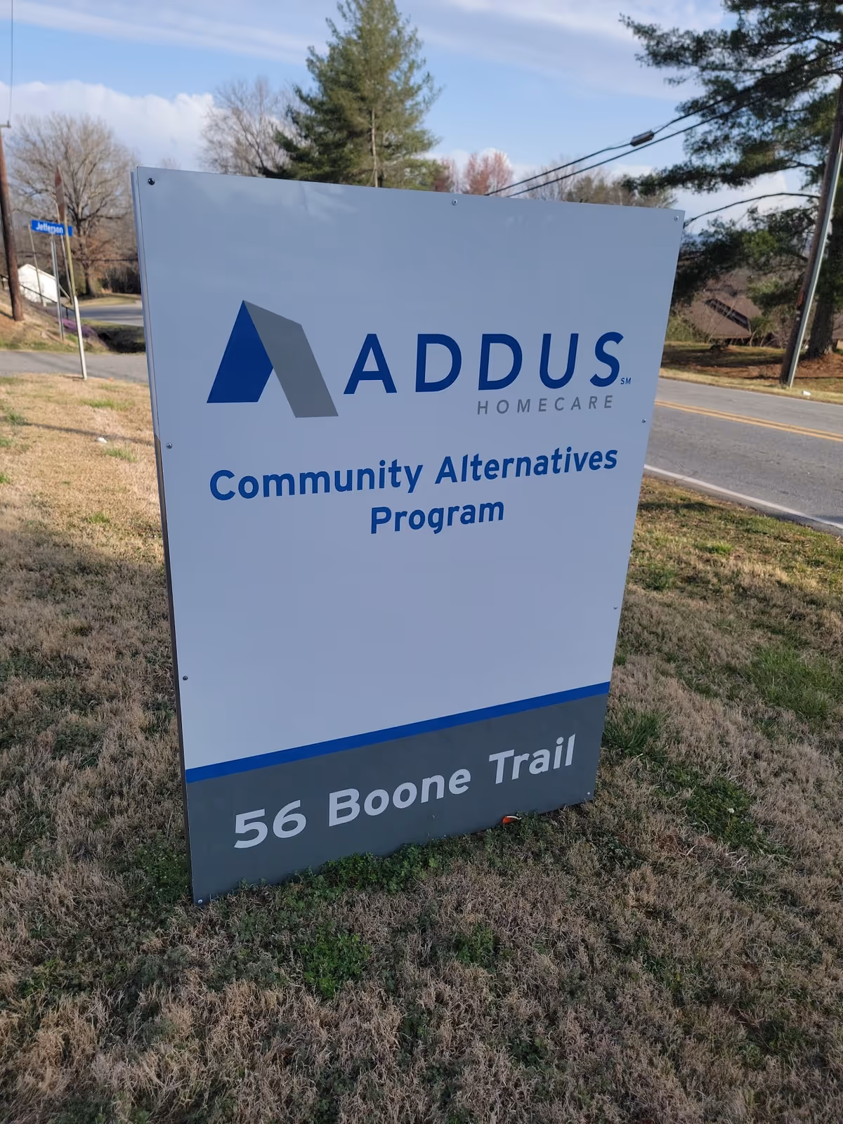 Large outdoor sign for Addus HomeCare Community Alternatives Program at 56 Boone Trail.