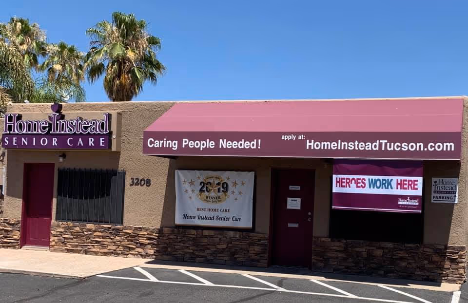 The storefront of Home Instead Senior Care with a purple awning and banners outside