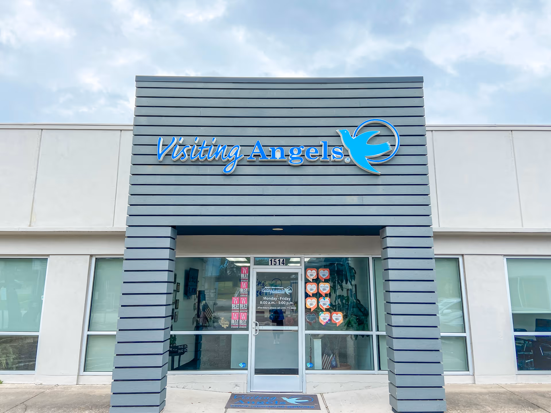 Front view of Visiting Angels Senior Home Care entrance with blue logo sign.