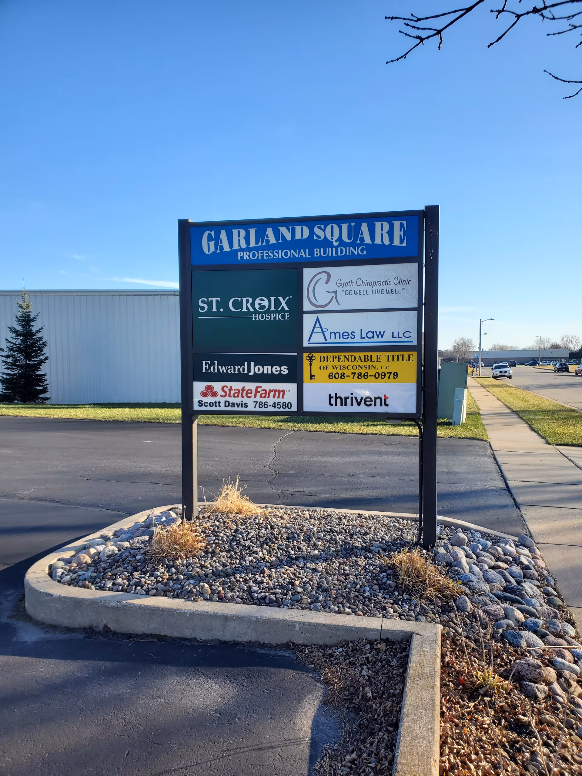 Outdoor signboard for Garland Square Professional Building with multiple company logos, including St. Croix Hospice.