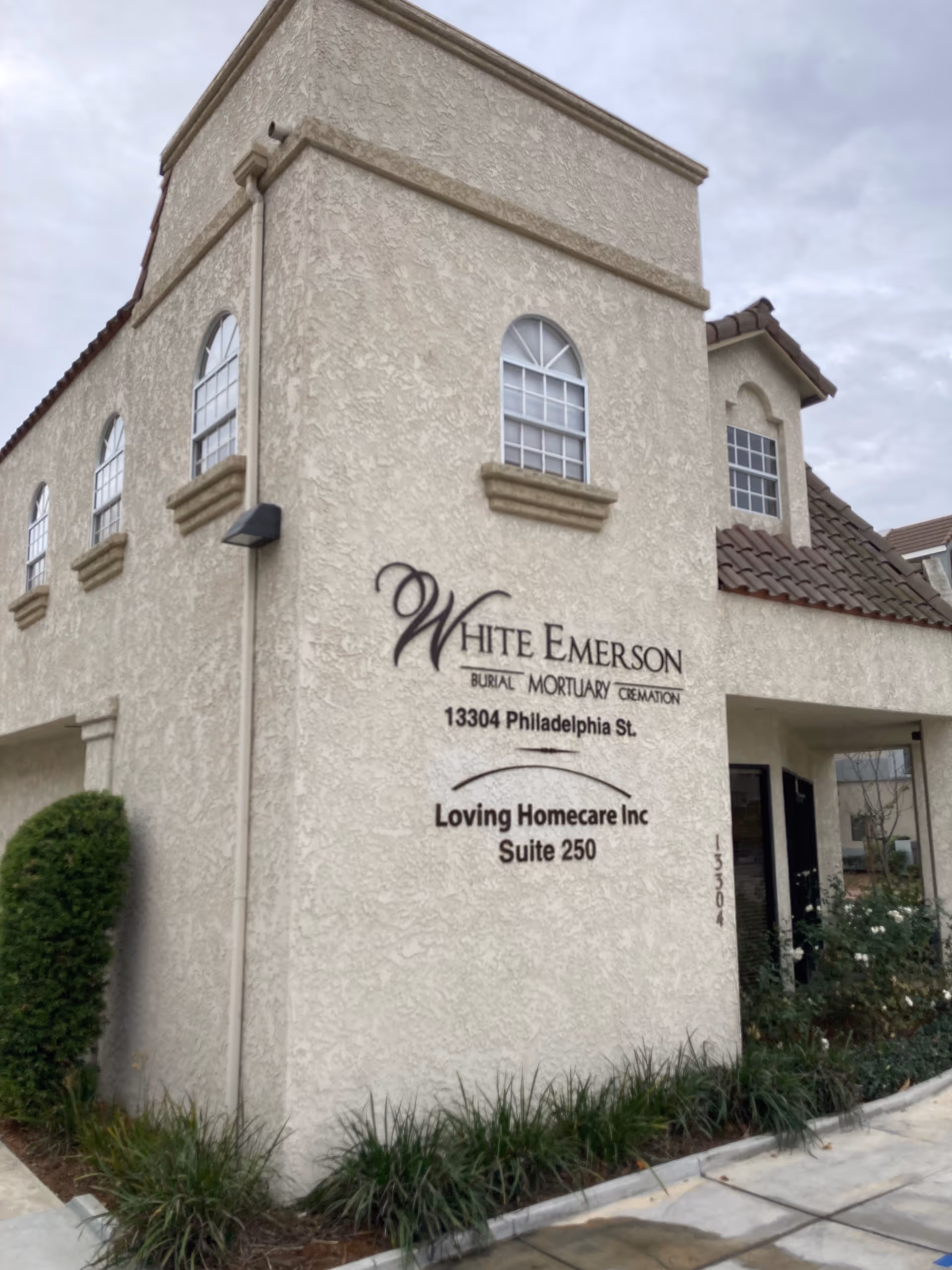 Beige building exterior with Loving Homecare Inc Suite 250 signage.