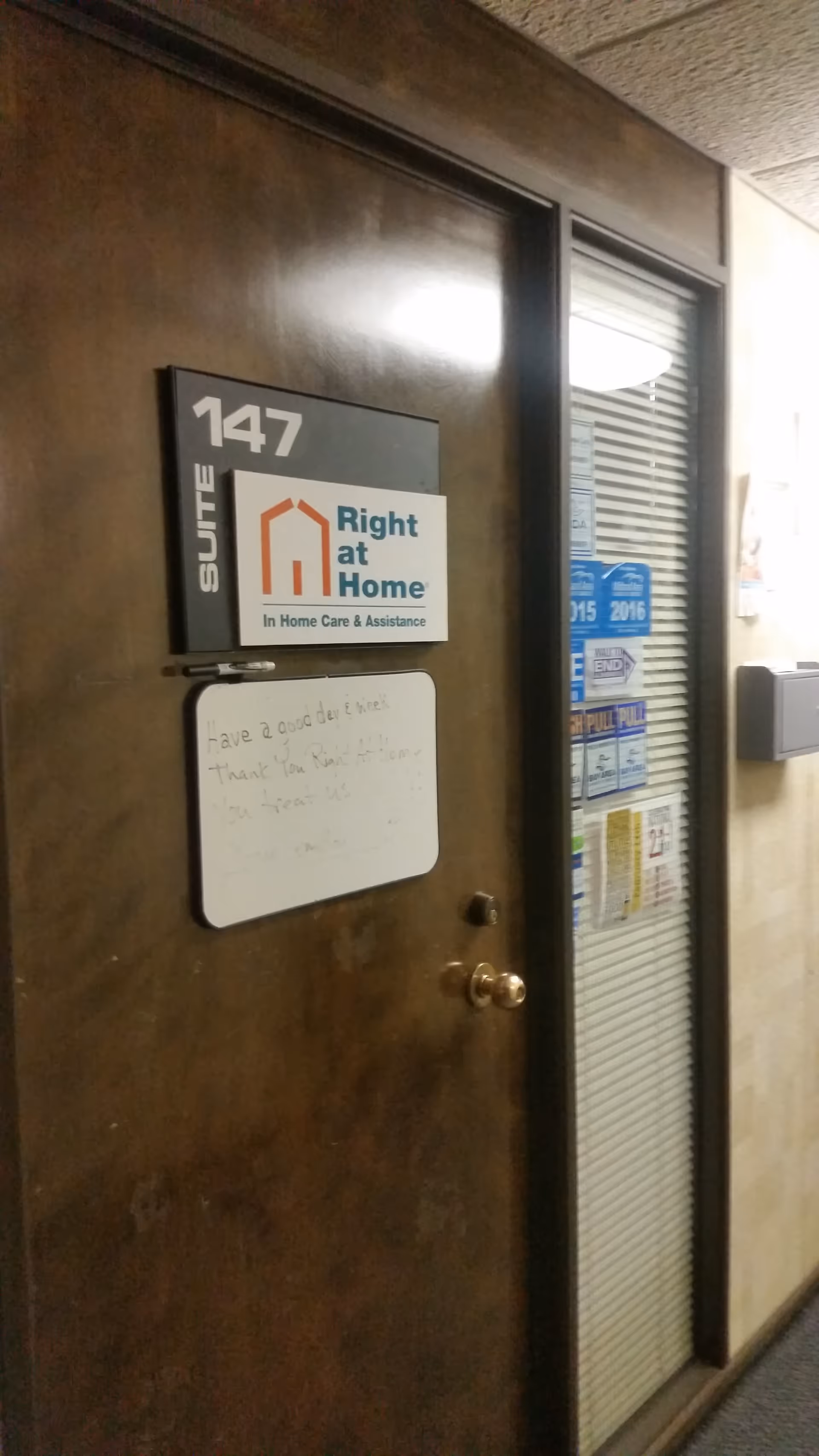 Door labeled 147 with suite sign and Right at Home logo in hallway.