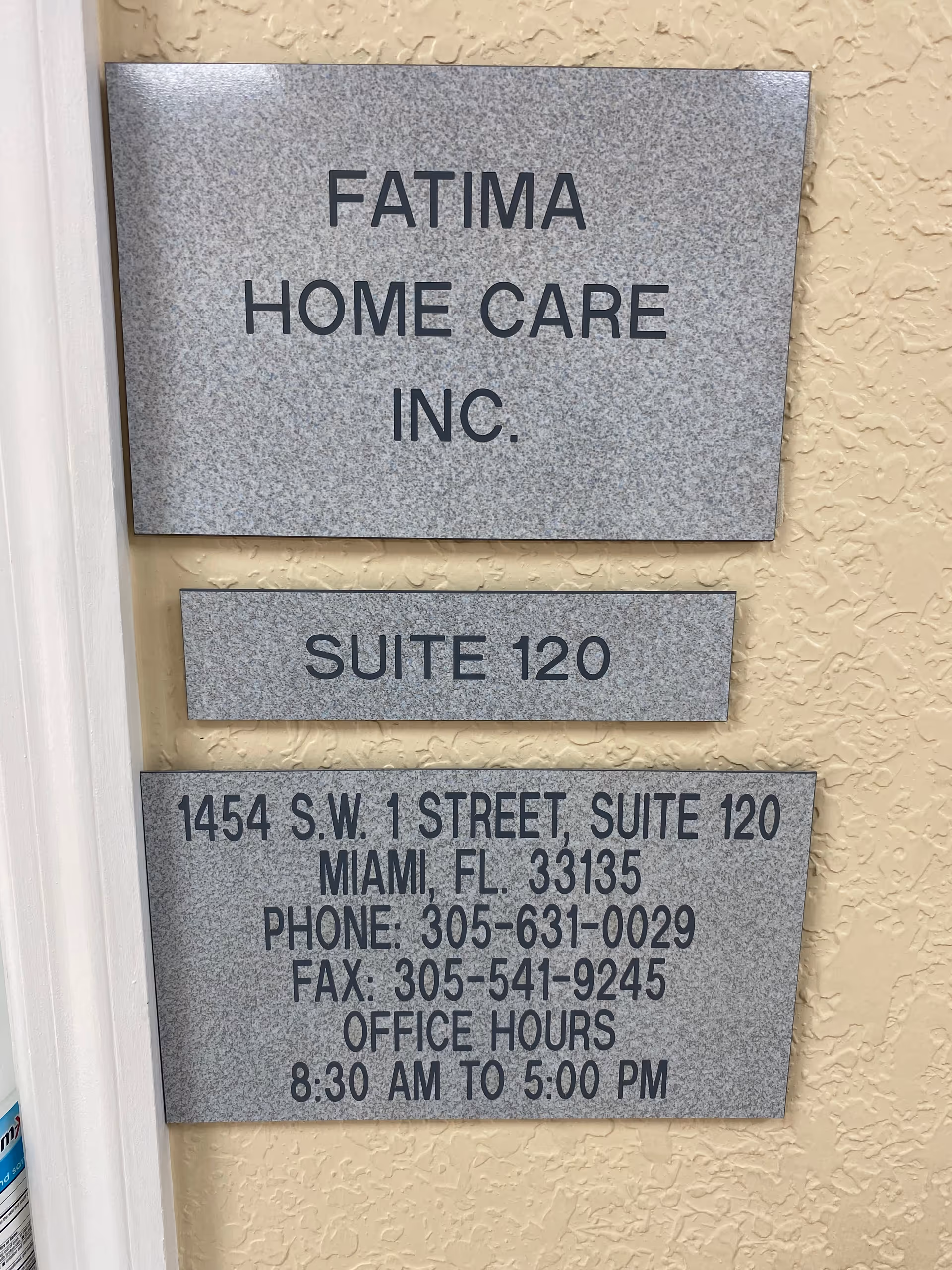 Exterior wall with Fatima Home Care Inc. Suite 120 sign and contact details.