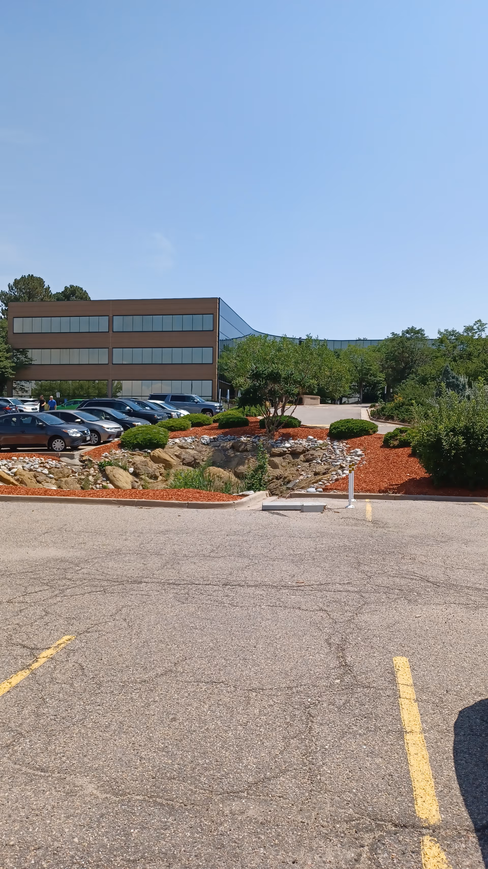 Exterior view of Enhabit Home Health facility with parking and landscaped entrance.