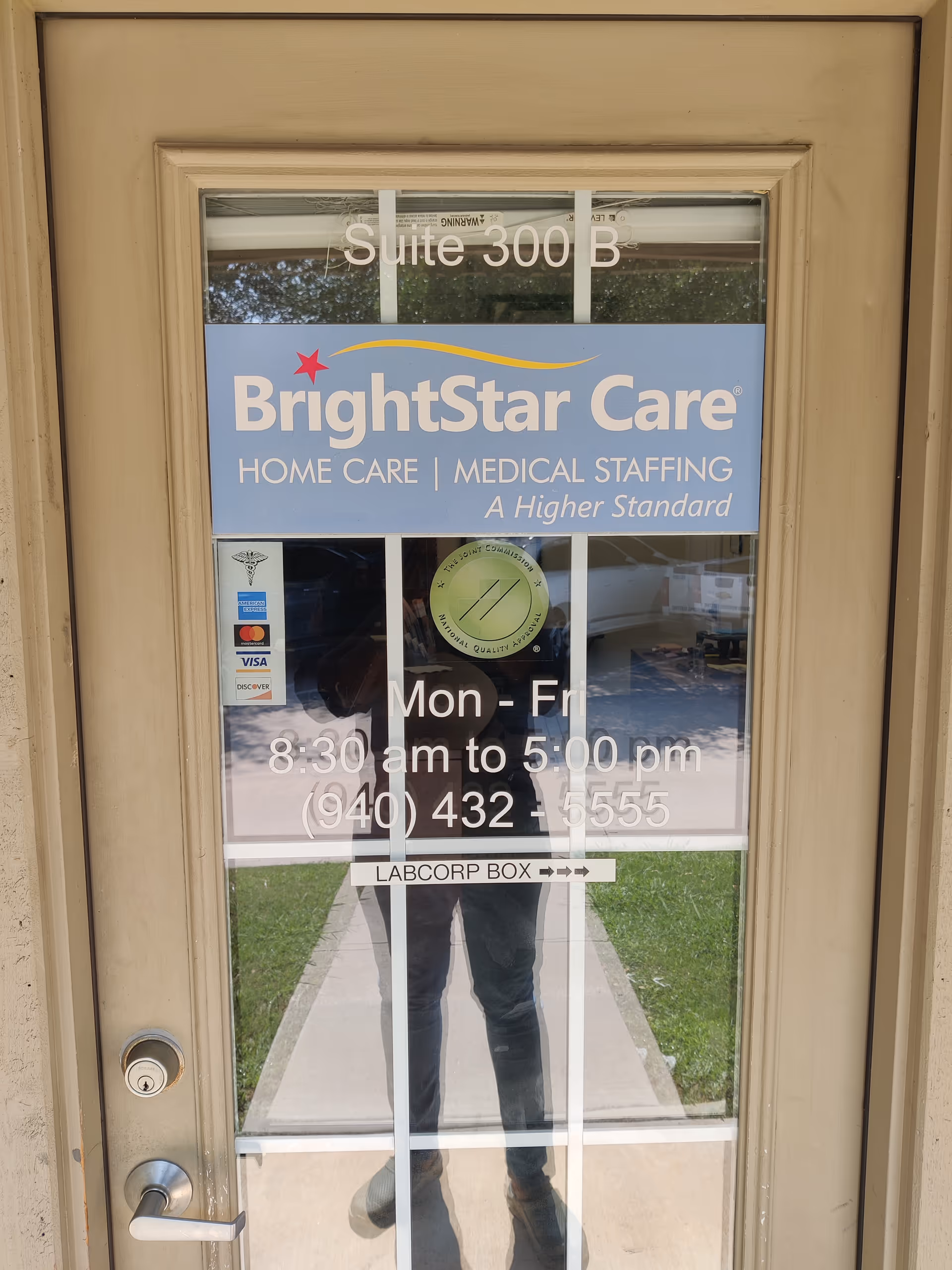 Glass door entry shows BrightStar Care signage, suite 300 B, and business hours.