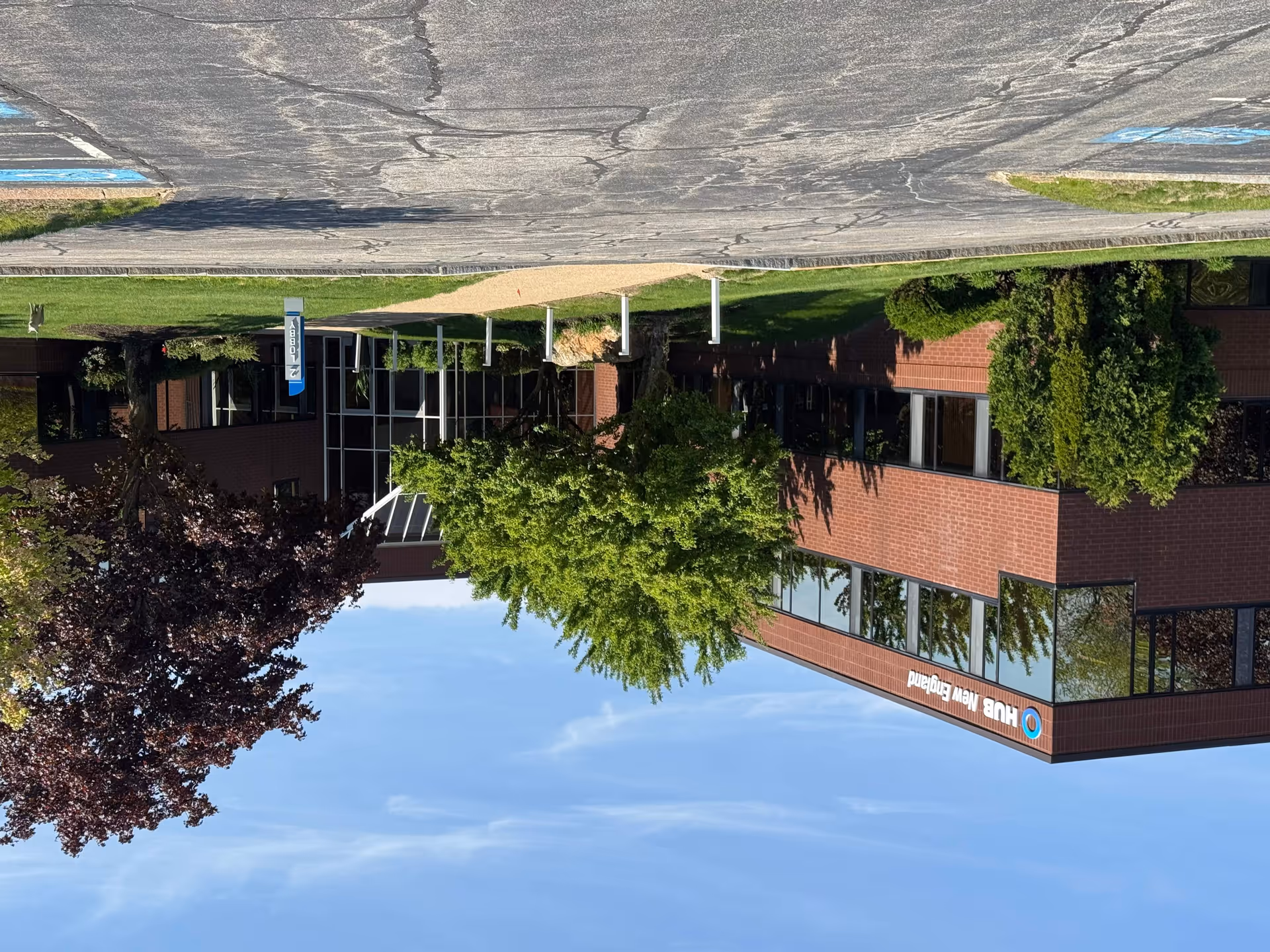 Exterior view of a BAYADA Home Health building with brick facade and trees.