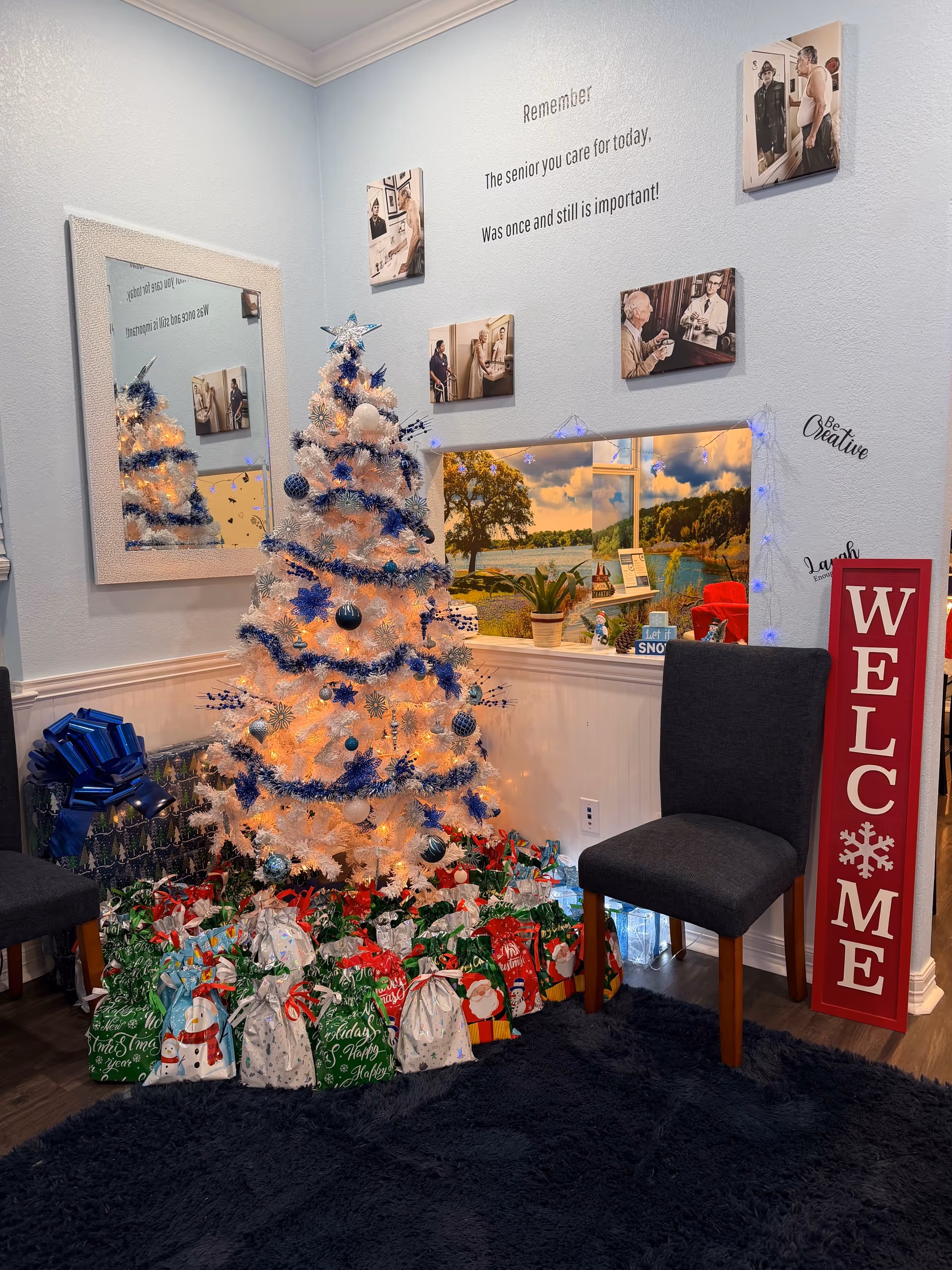 A festive Christmas tree with wrapped gifts sits in a cozy, decorated corner.
