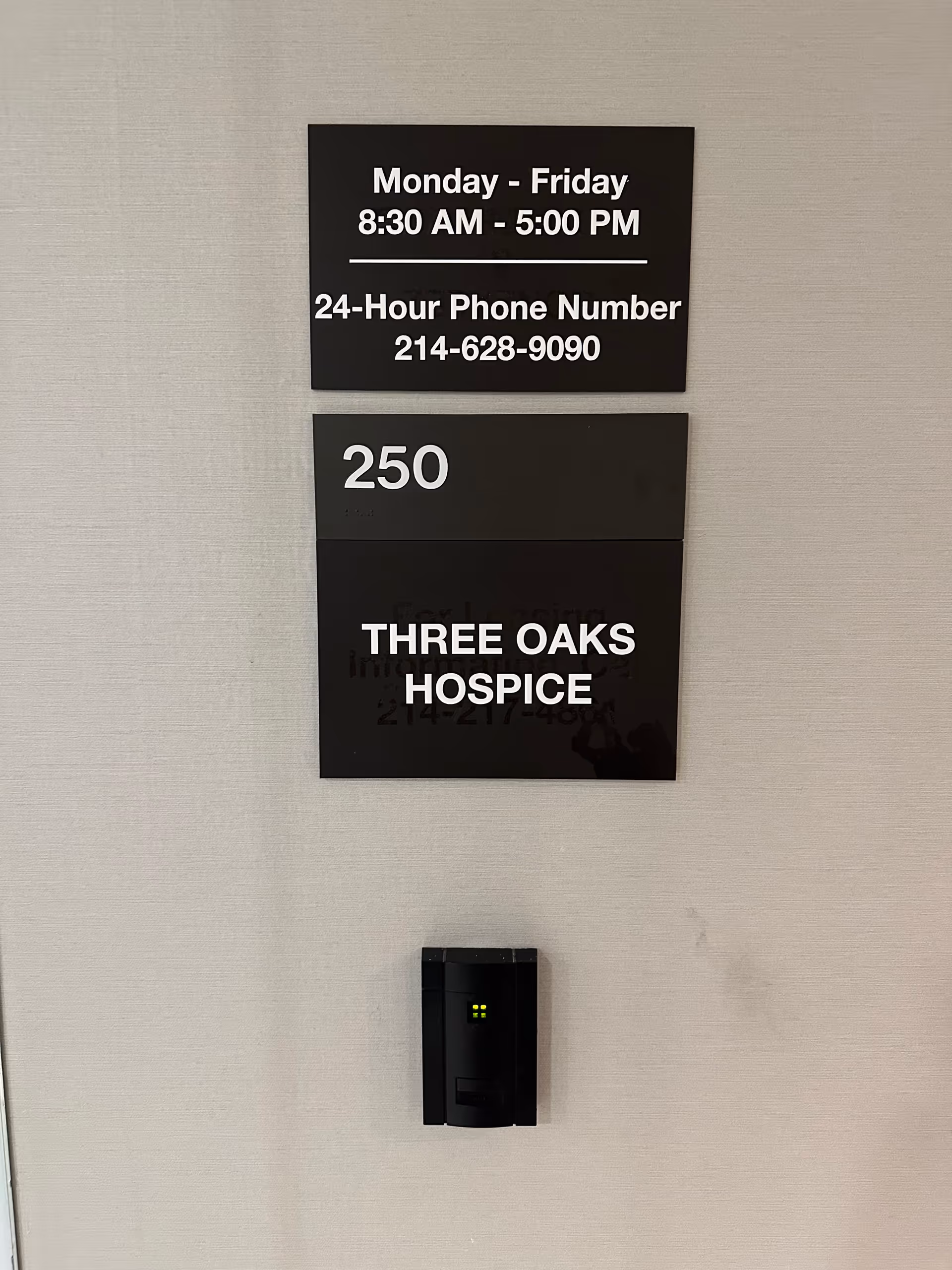 Interior wall with Three Oaks Hospice signage, room 250, and a keypad reader