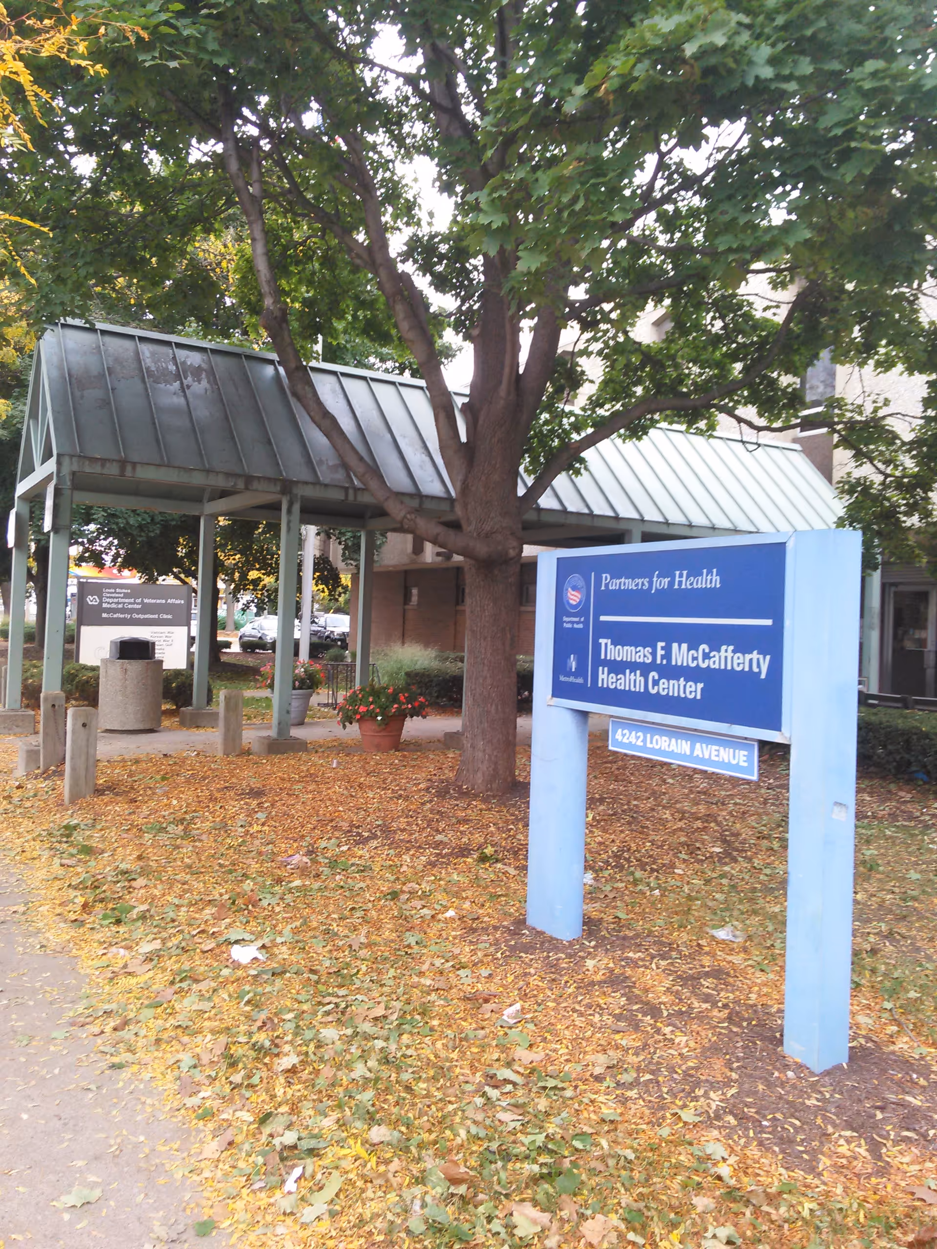Exterior view of the Thomas F. McCafferty Health Center entrance with a blue sign.