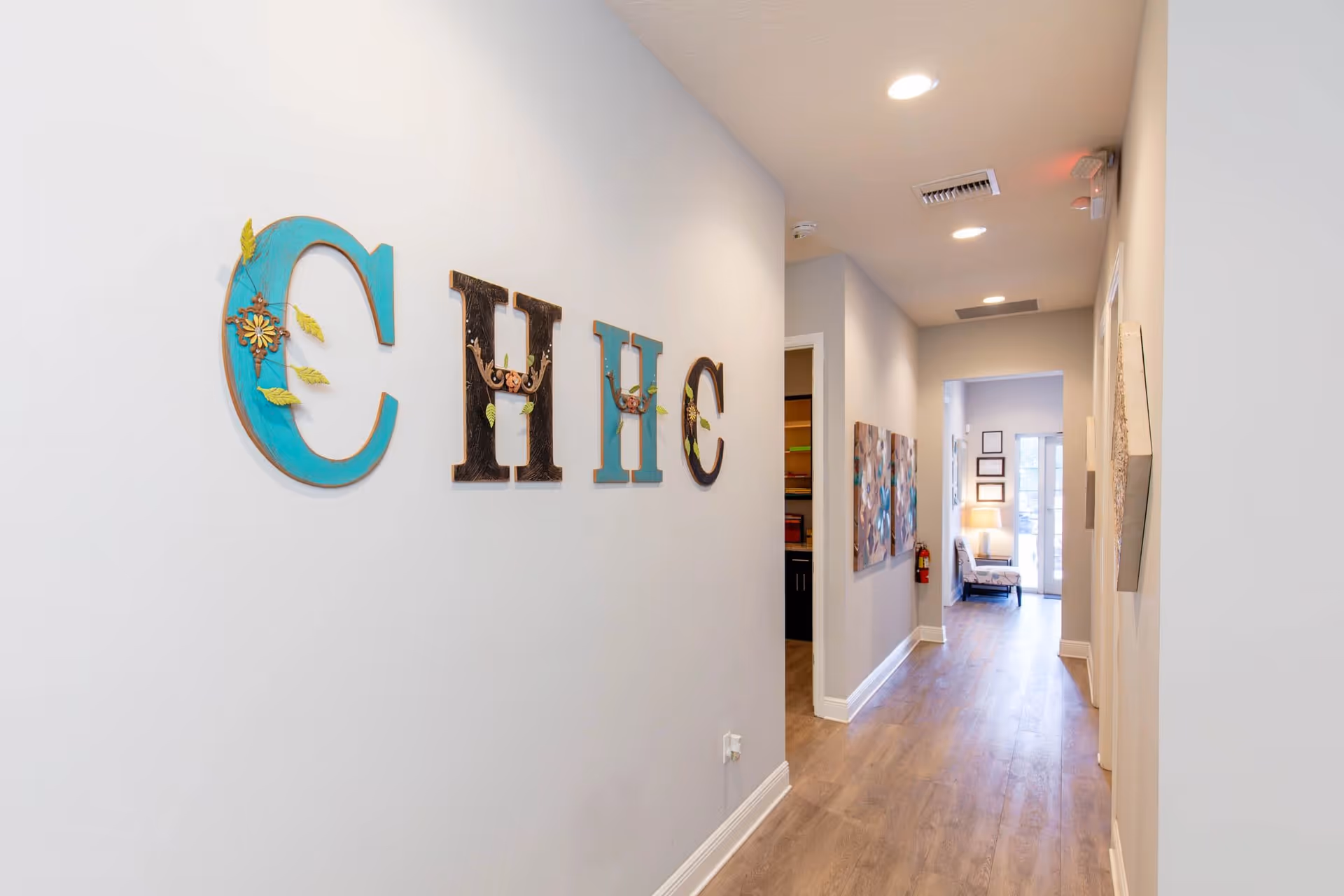 Hallway interior of Champion Home Health Care PRIVATE DUTY with decorative wall sign.