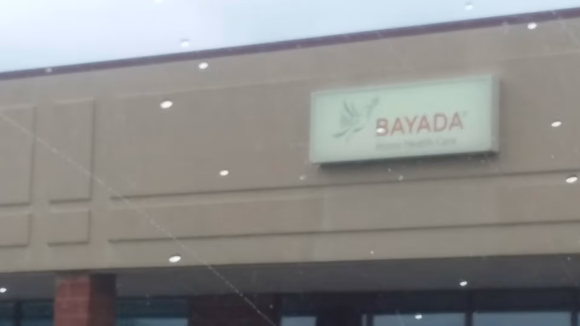 Exterior view of BAYADA Pediatrics facility with sign on the building facade.
