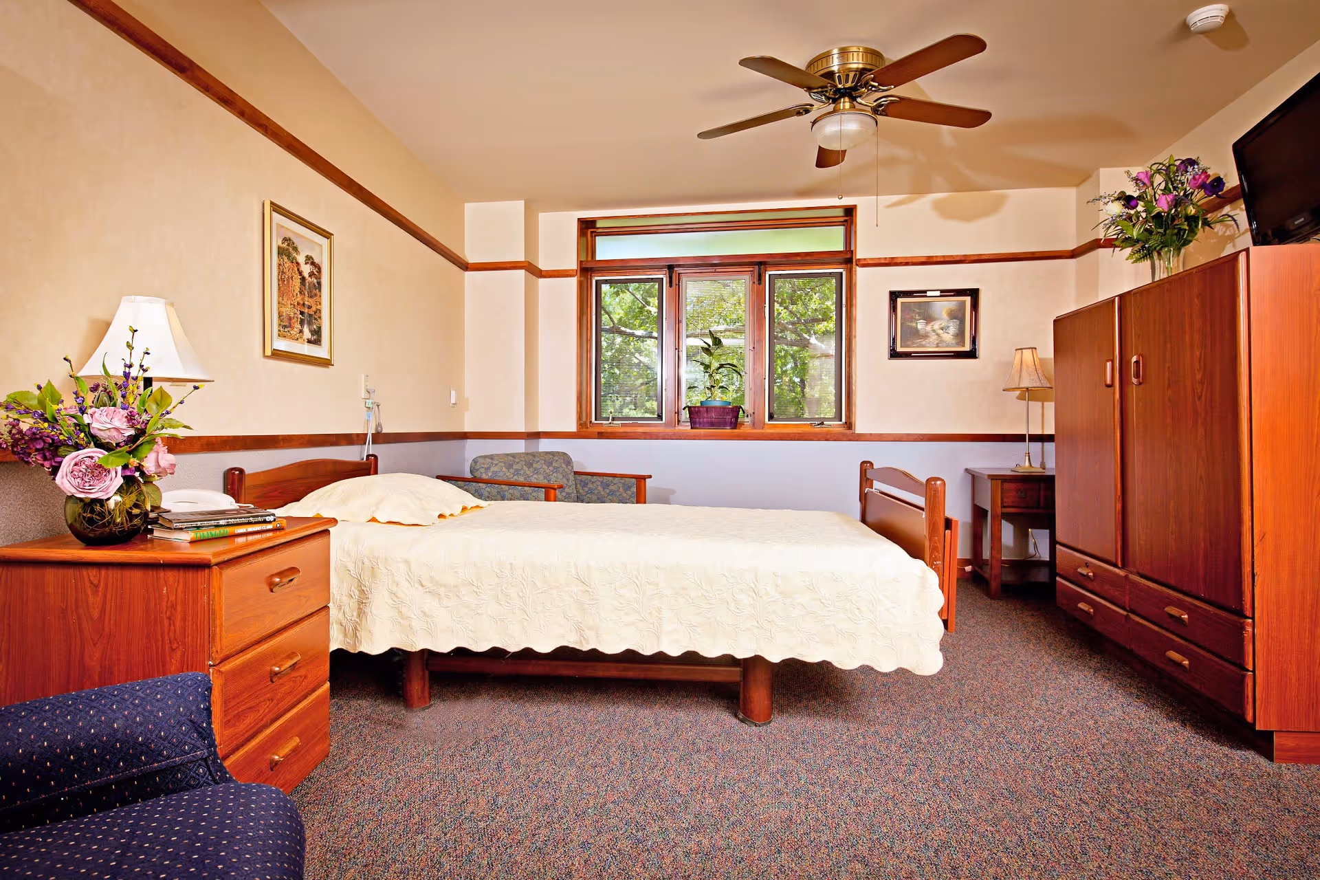 Single resident bedroom with bed, dresser, wardrobe, and window view.