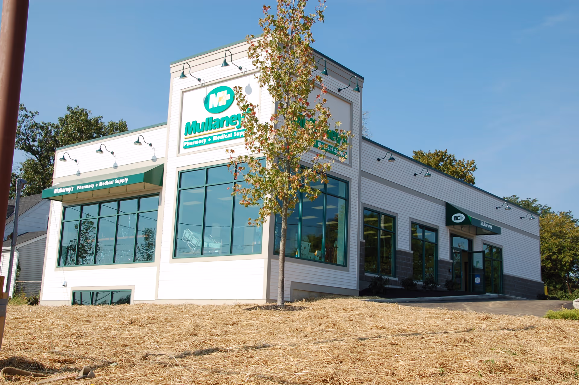 Exterior view of a modern medical supply storefront with large windows and signage.