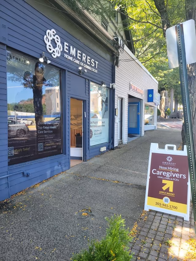 Exterior view of Emerest Home Care storefronts along a sidewalk.