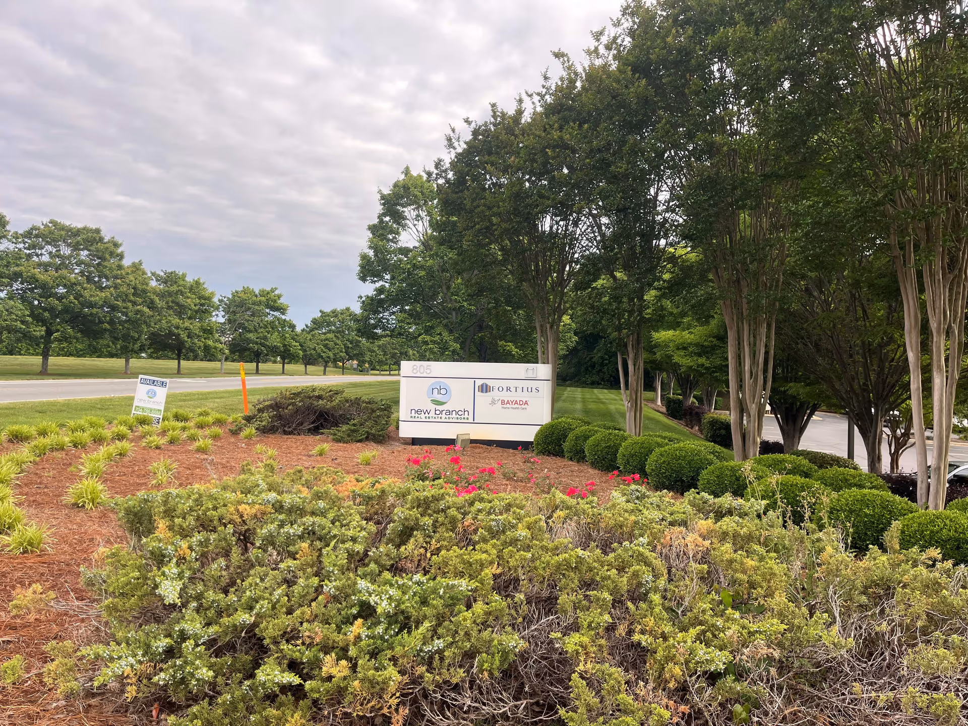 Exterior view of BAYADA Home Health facility with sign and landscaped entrance.