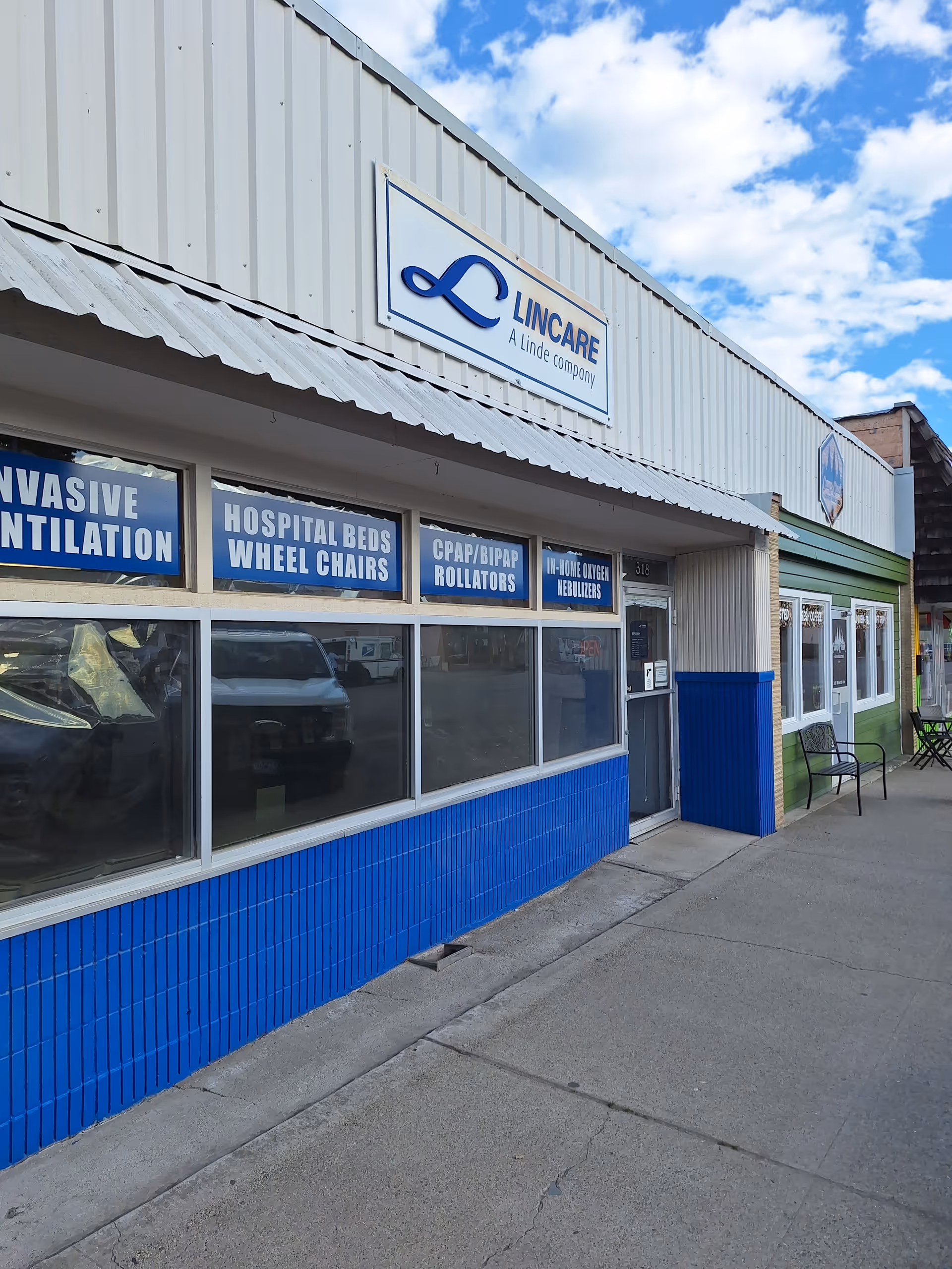 Exterior view of a LINCARE storefront with blue signs and large windows