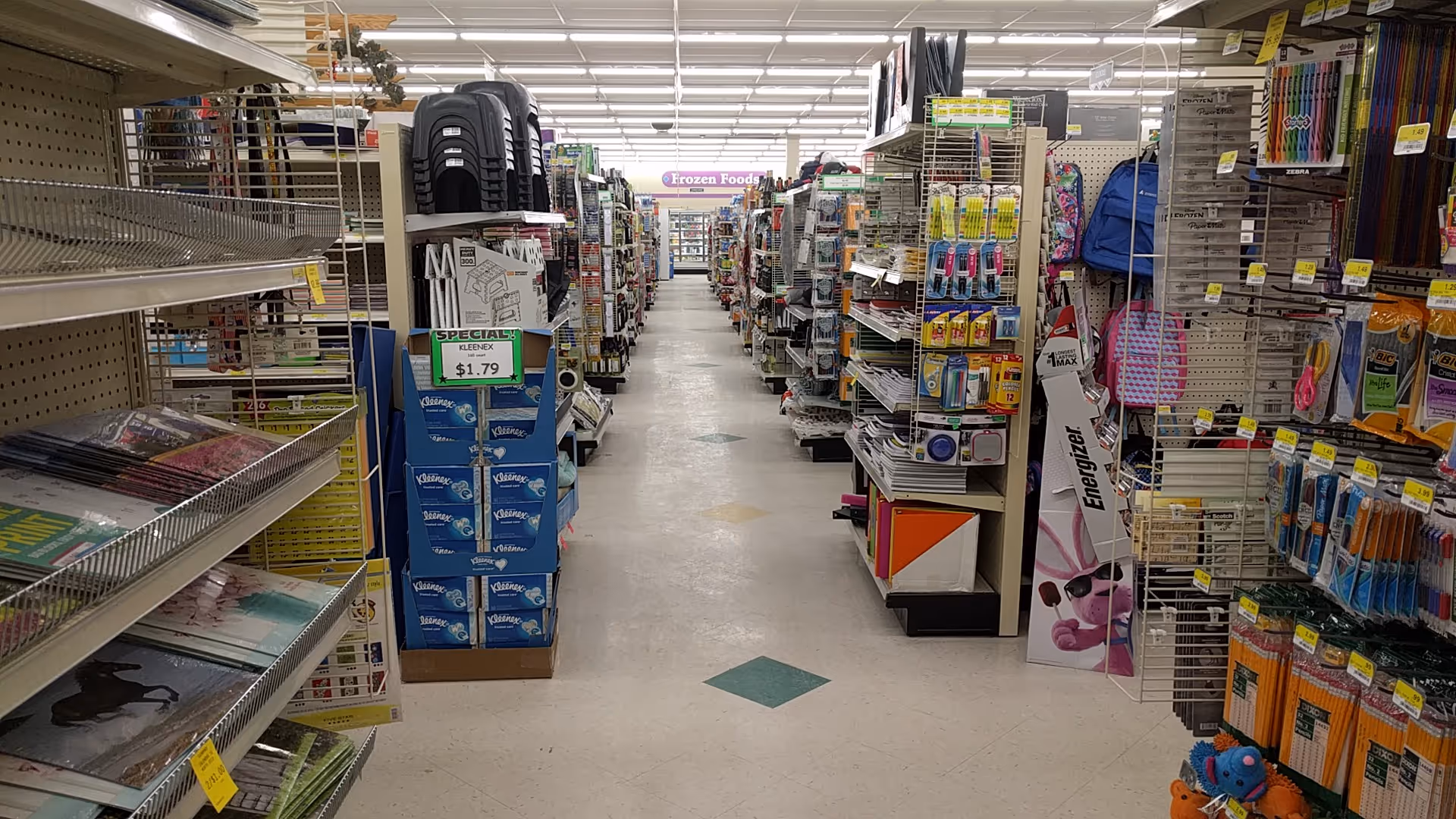 Aisle inside Discount Drug Mart filled with shelves of medical and daily items.