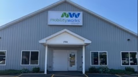 Grey metal building front with MobilityWorks sign and central entrance.