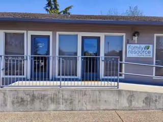 Front view of a Family Resource Home Care entrance with glass doors and a ramp.
