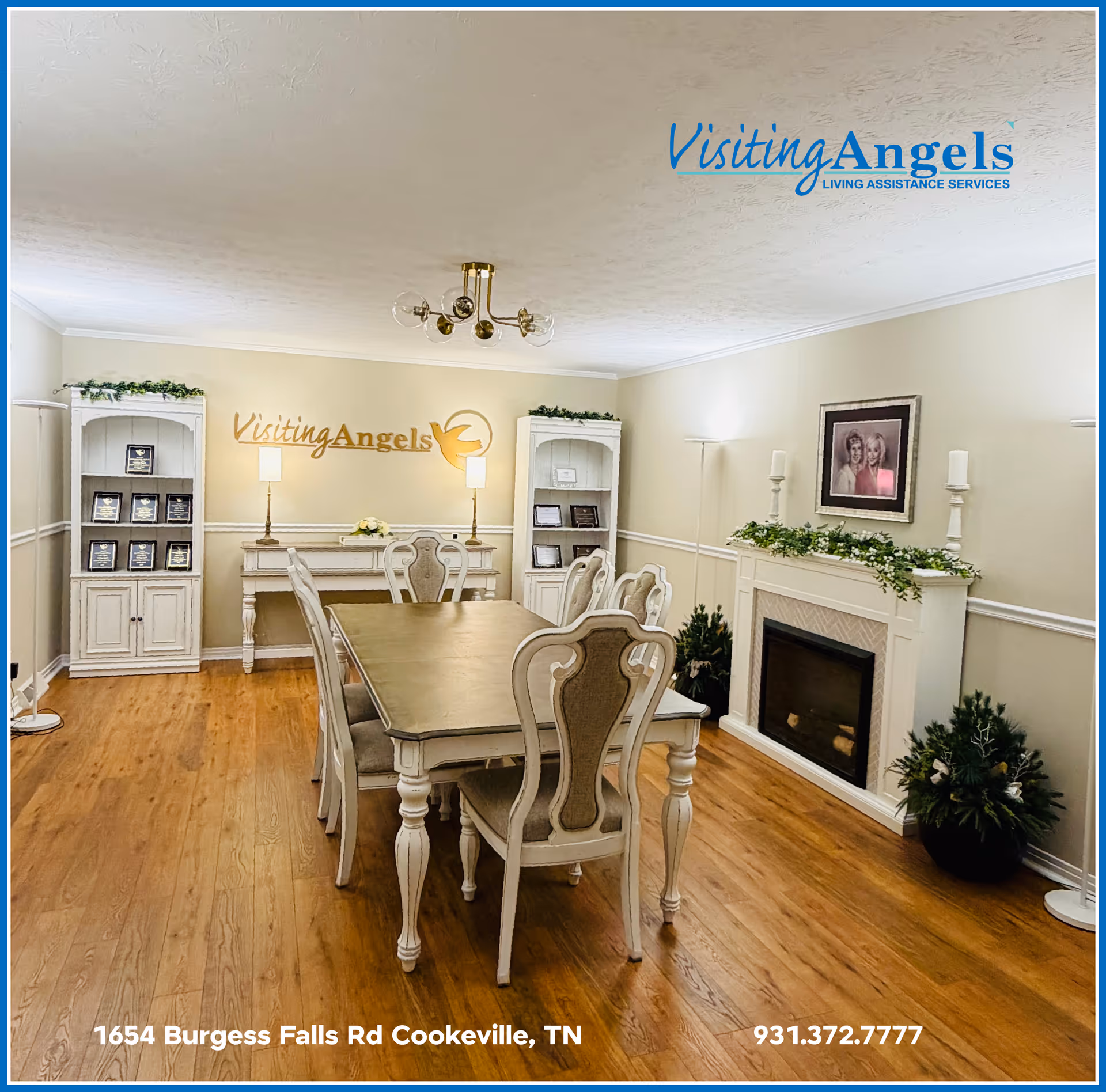 A bright dining room with a long table, chairs, and fireplace in a Visiting Angels facility.